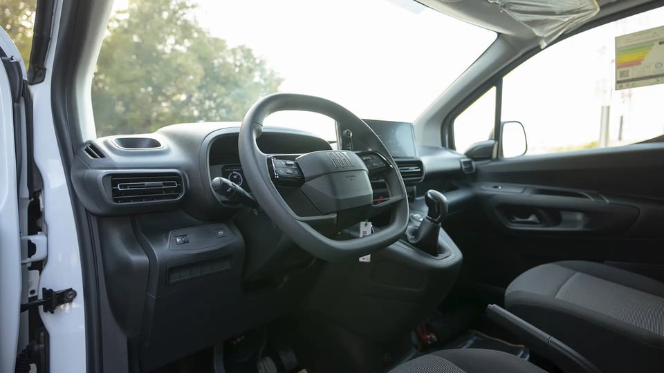 Used 2025 Fiat Doblo Cargo in White – Driver Side Dashboard & Steering View for Sale at First Choice Cars Dubai Sharjah