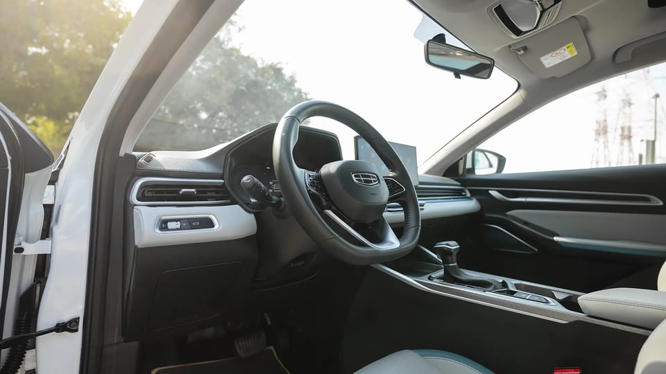 Used 2025 Geely Emgrand GF in White – Driver Side Dashboard & Steering View for Sale at First Choice Cars Dubai Sharjah