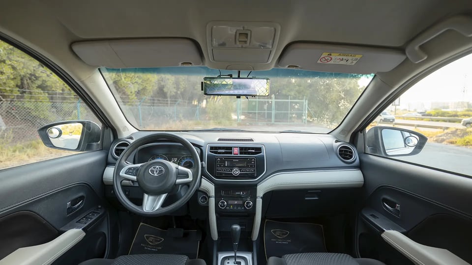 Used 2022 Toyota Rush EX in White – Front Cabin / Dashboard Full View for Sale at First Choice Cars Dubai Sharjah