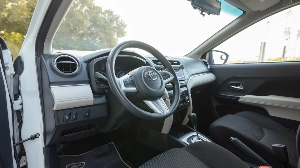 Used 2022 Toyota Rush EX in White – Driver Side Dashboard & Steering View for Sale at First Choice Cars Dubai Sharjah