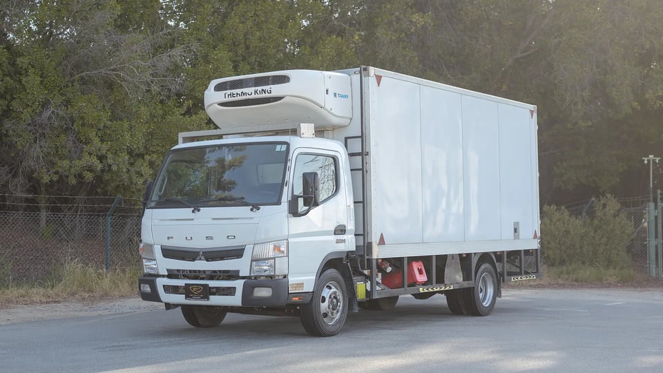 Used 2022 Mitsubishi Canter Chiller Box in White – Left Front Diagonal (45°) View for Sale at First Choice Cars Dubai Sharjah