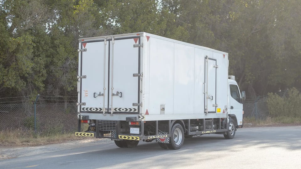Used 2022 Mitsubishi Canter Chiller Box in White – Right Back Diagonal (45°) View for Sale at First Choice Cars Dubai Sharjah