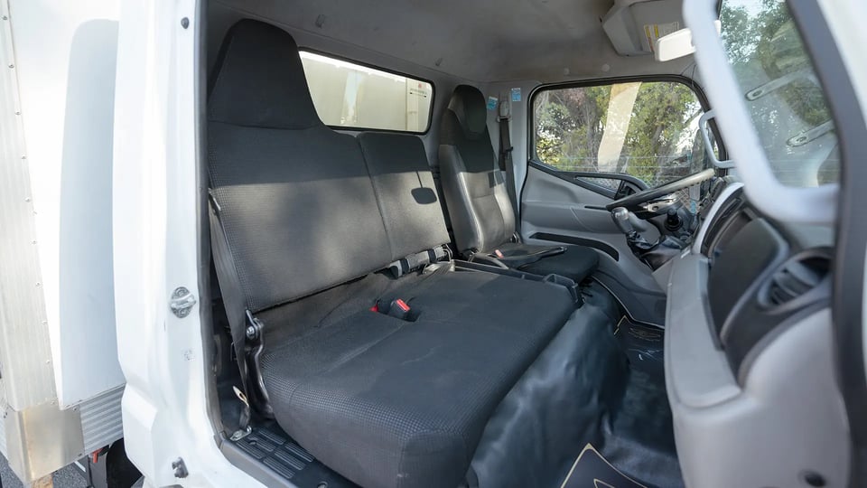 Used 2022 Mitsubishi Canter Chiller Box in White – Front Passenger Side Cabin View for Sale at First Choice Cars Dubai Sharjah