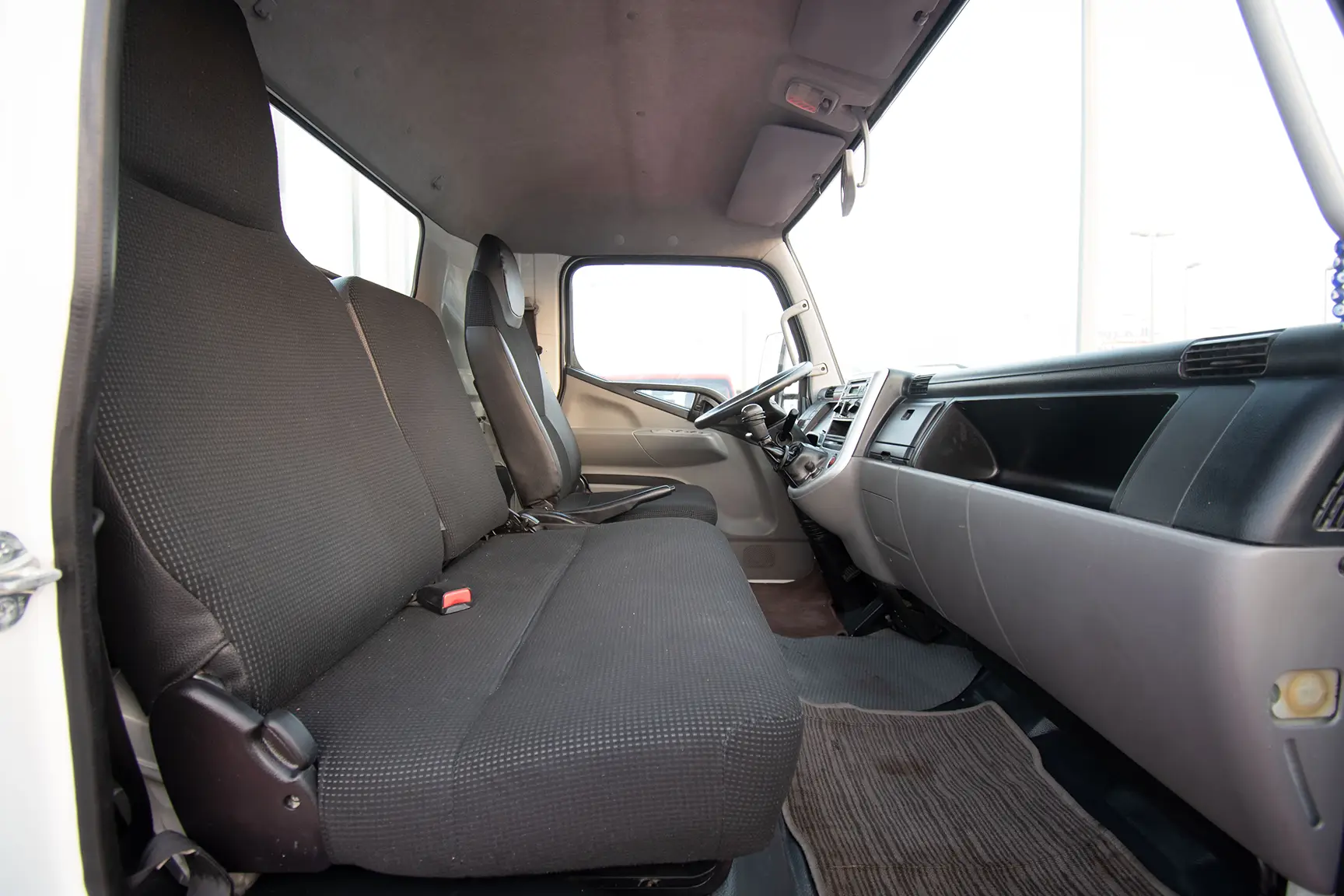 Used 2017 Mitsubishi Canter Cargo Body White – Front Passenger Side Cabin View at First Choice Cars Sharjah