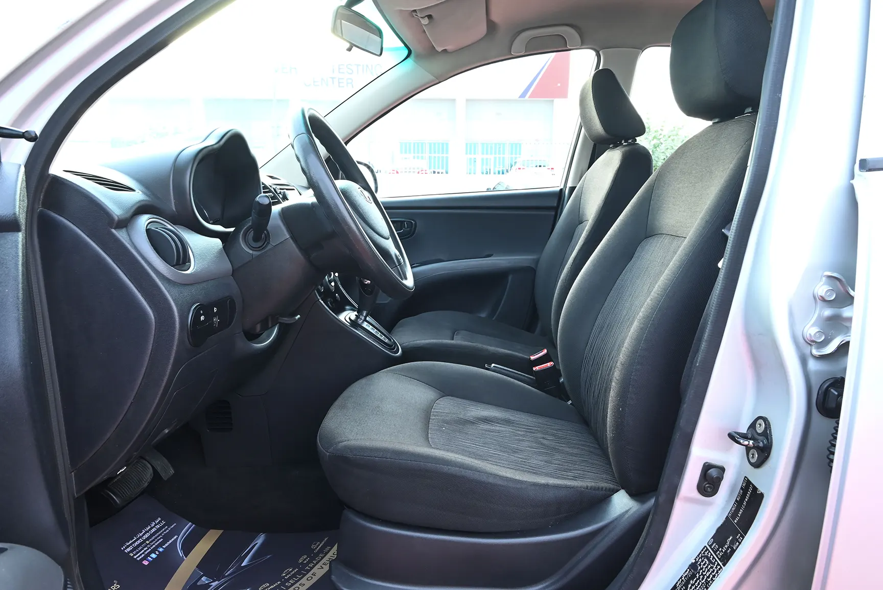 Used 2015 Hyundai i10 GL Silver – Front Driver Side Cabin View at First Choice Cars Sharjah