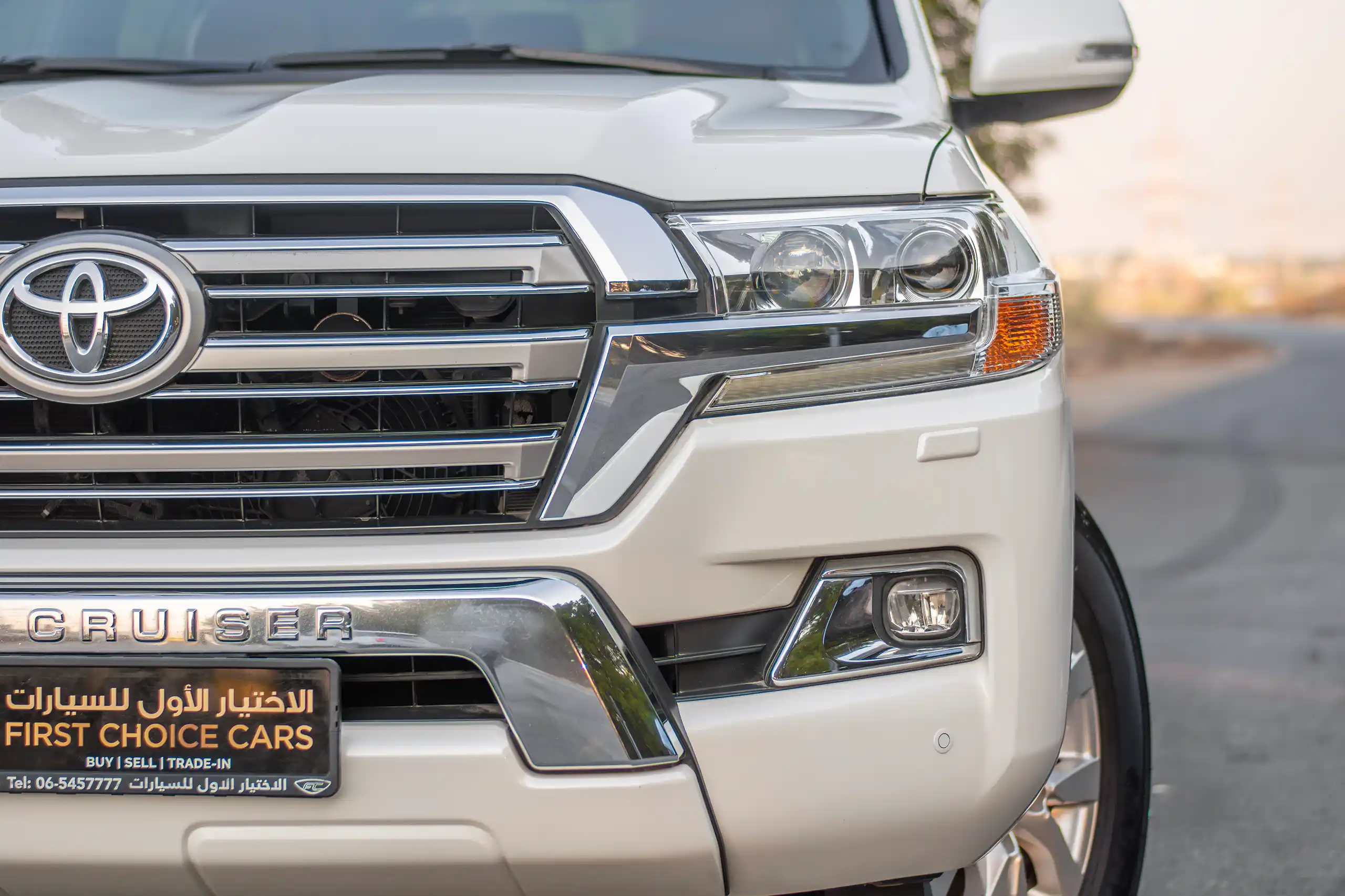 Used 2016 Toyota Land Cruiser Gxr 5.7L V8 White – Headlight Close-up at First Choice Cars Sharjah