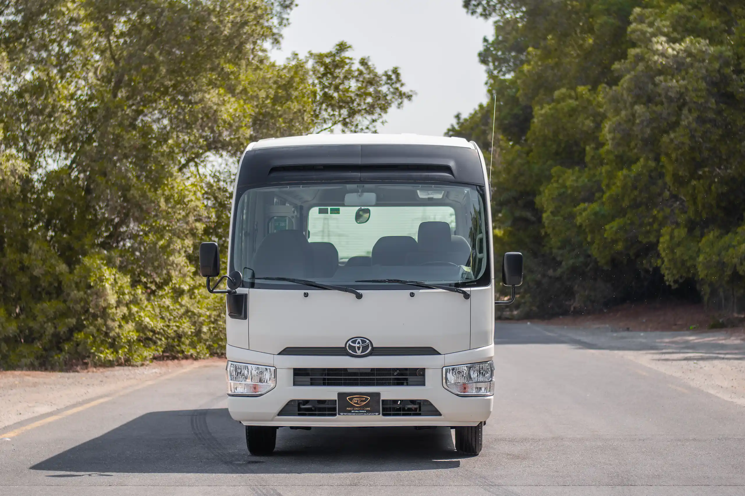 Used 2020 Toyota Coaster Bus White – Front View at First Choice Cars Sharjah