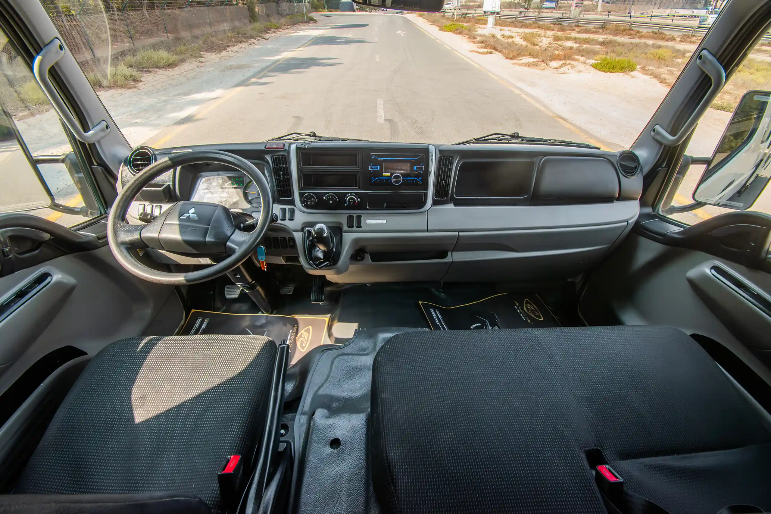 Used 2023 Mitsubishi Canter Double Cabin White – Front Cabin / Dashboard Full View at First Choice Cars Sharjah