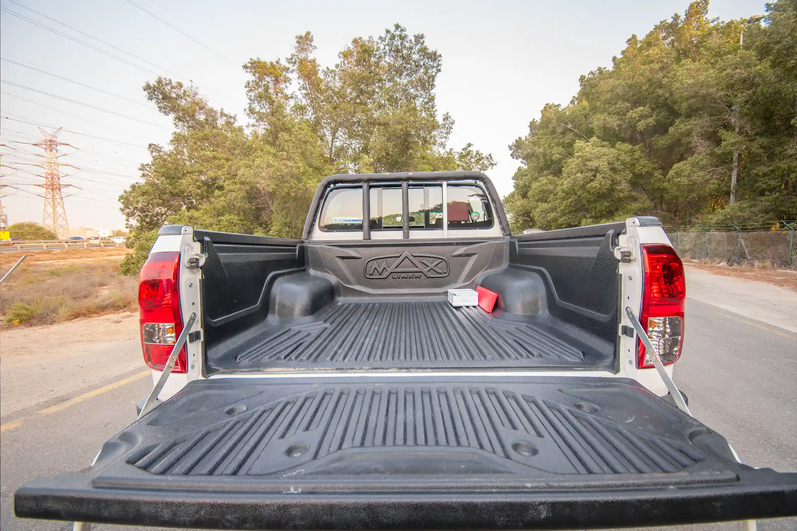 Used 2024 Toyota Hilux Dlx Double Cabin White – Cargo Box Inside View at First Choice Cars Sharjah