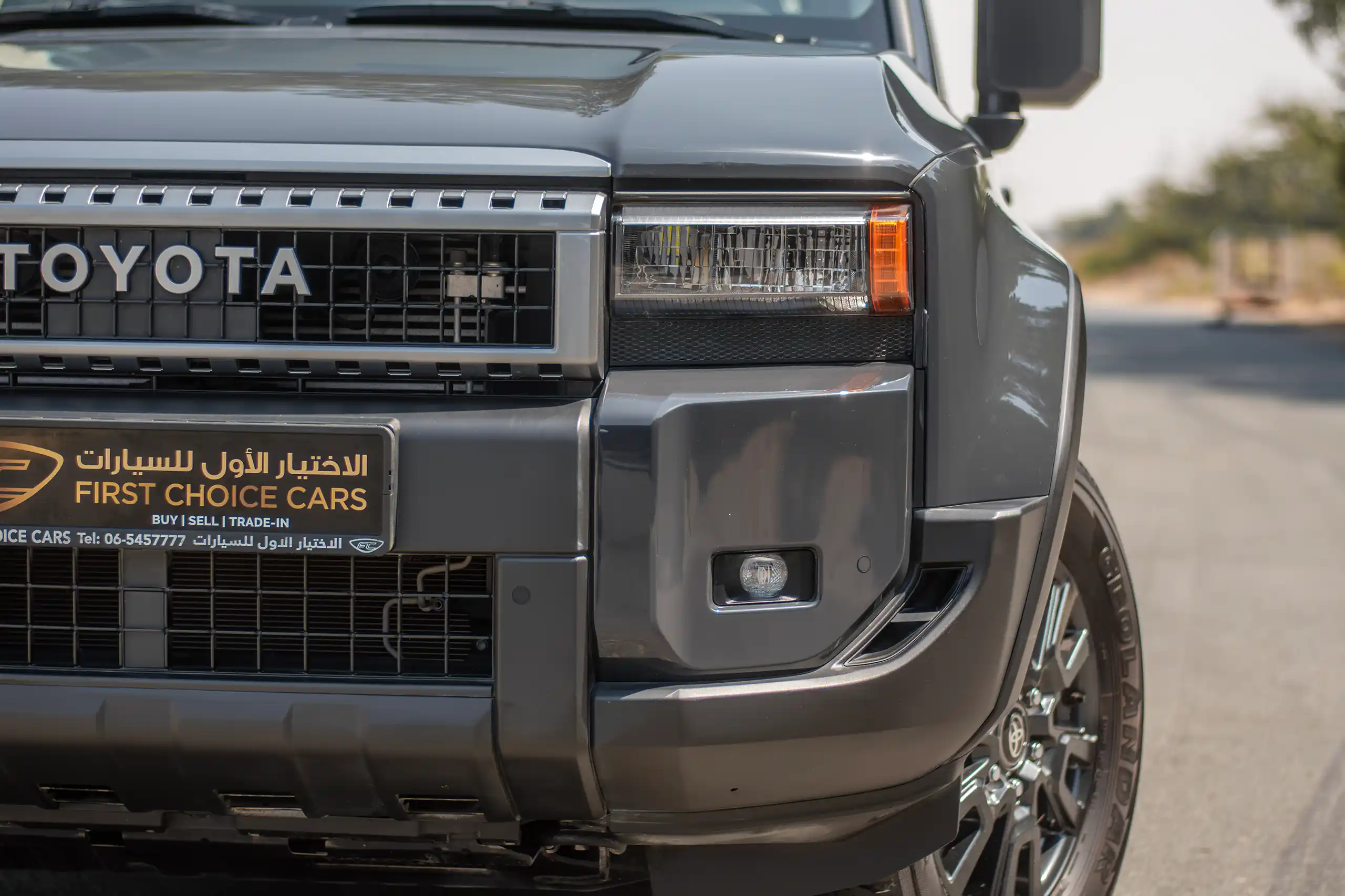 Used 2024 Toyota Prado TXR Grey – Headlight Close-up at First Choice Cars Sharjah
