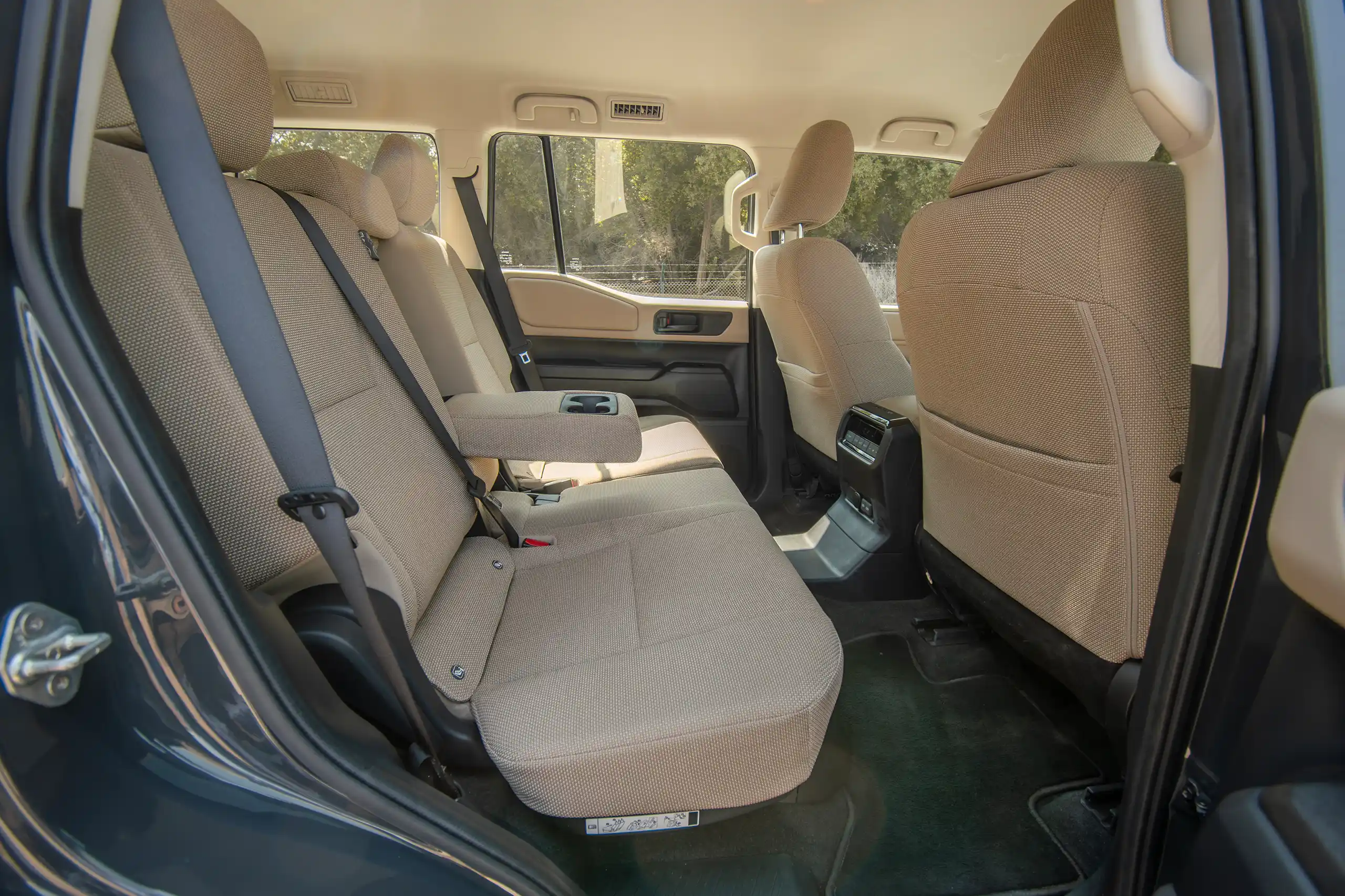 Used 2024 Toyota Prado TXR Grey – Rear Driver Side Cabin View at First Choice Cars Sharjah
