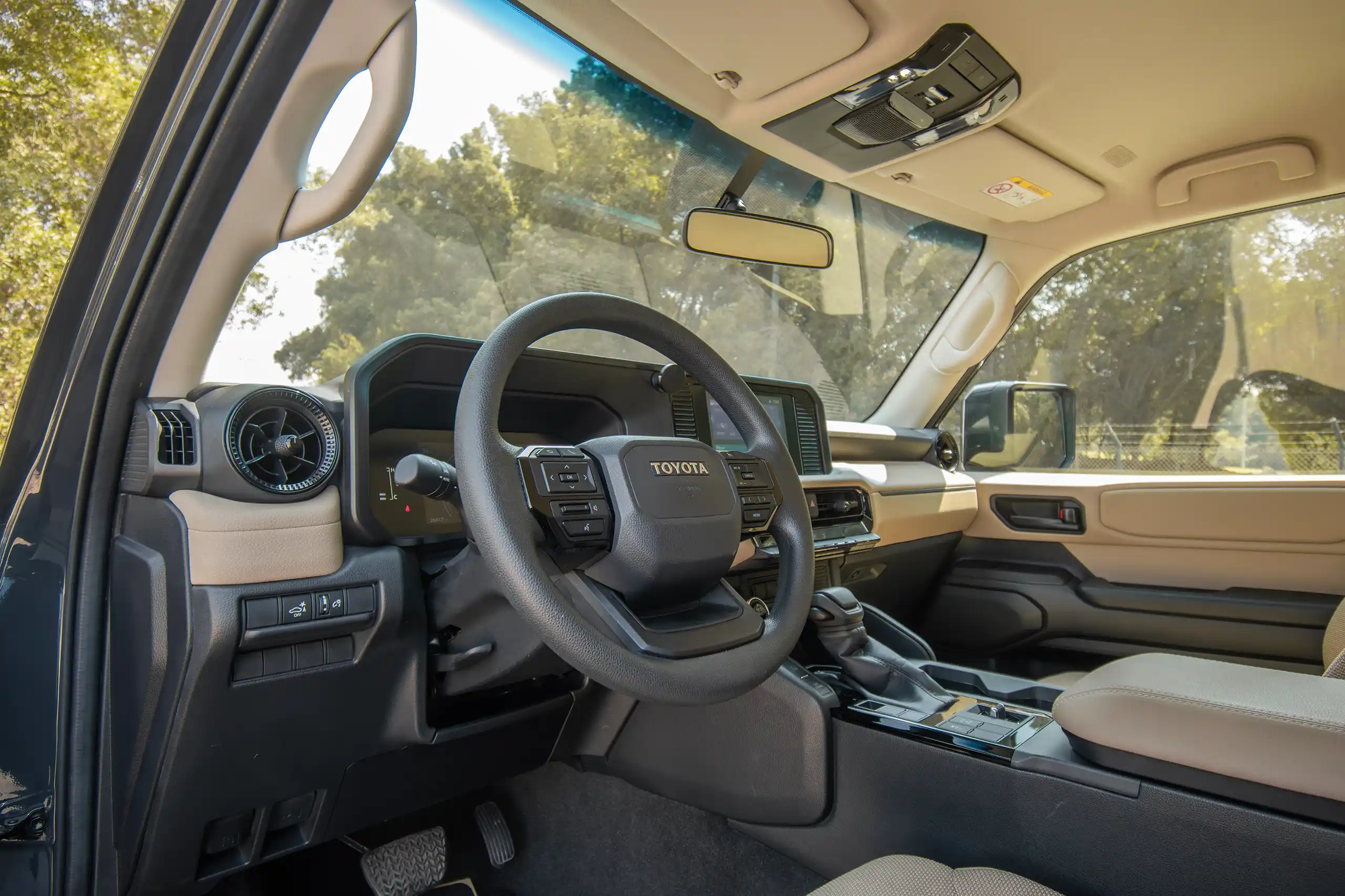 Used 2024 Toyota Prado TXR Grey – Driver Side Dashboard & Steering View at First Choice Cars Sharjah