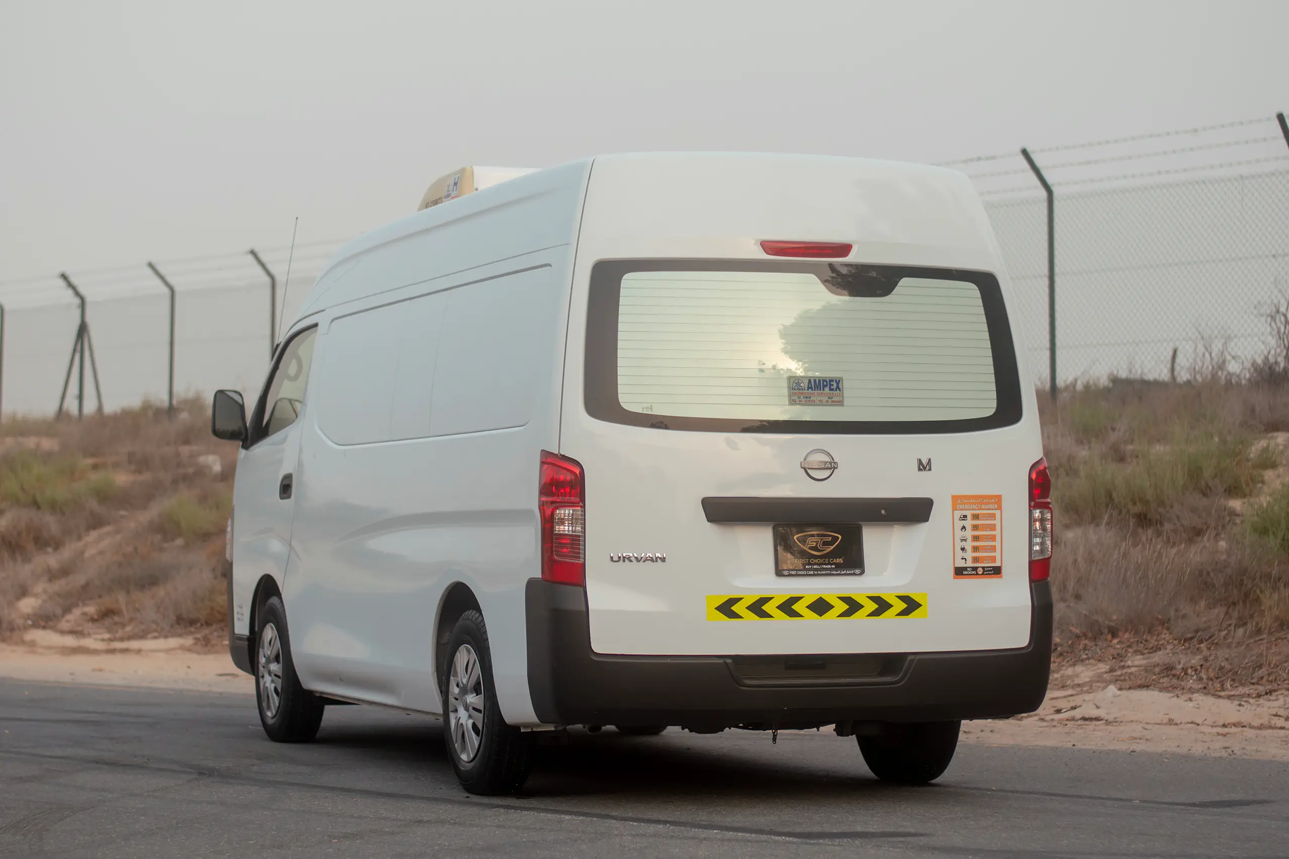Used 2023 Nissan Urvan High Roof Chiller White – Left Back Diagonal (45°) View at First Choice Cars Sharjah
