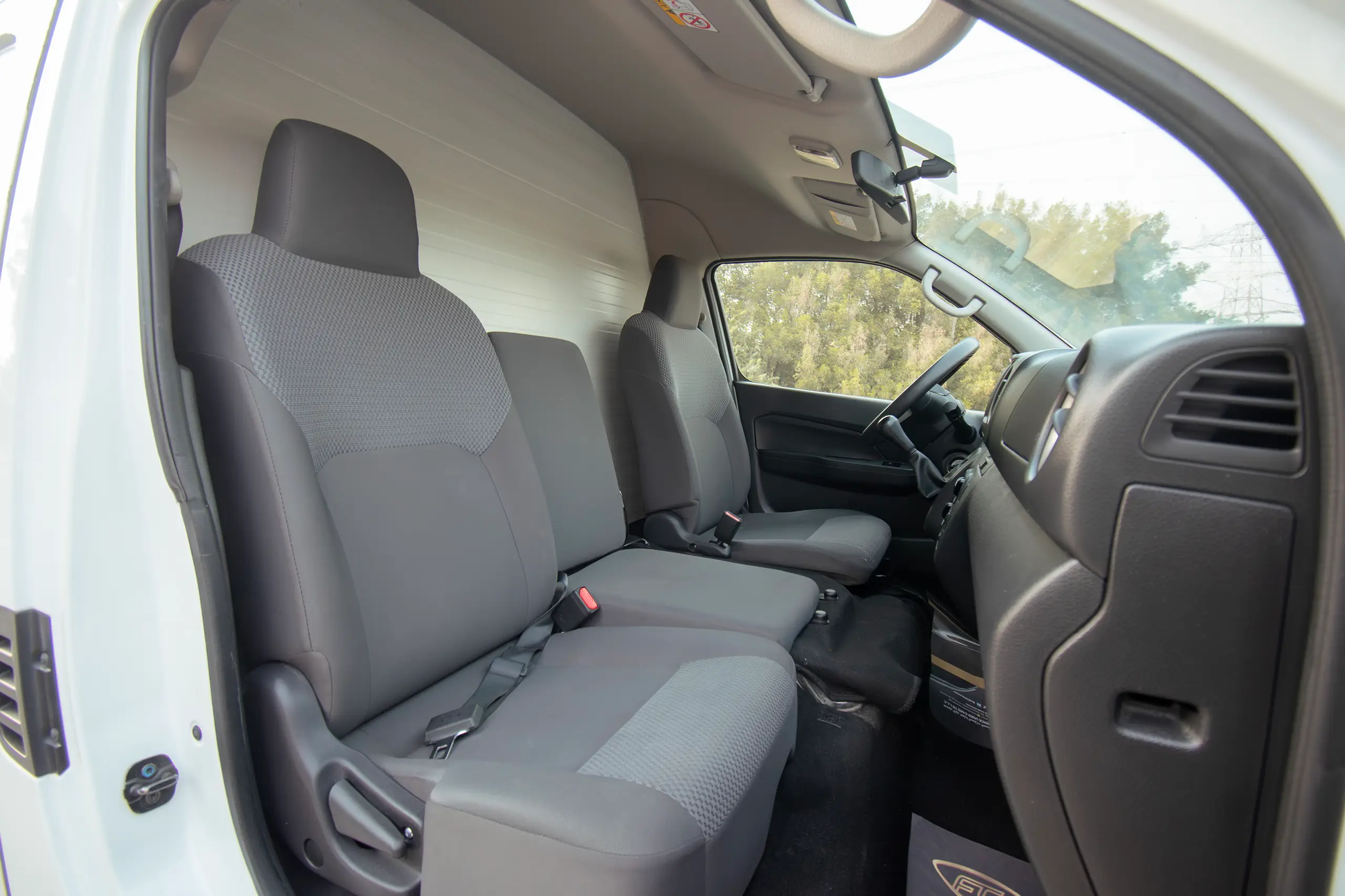 Used 2023 Nissan Urvan High Roof Chiller White – Front Passenger Side Cabin View at First Choice Cars Sharjah