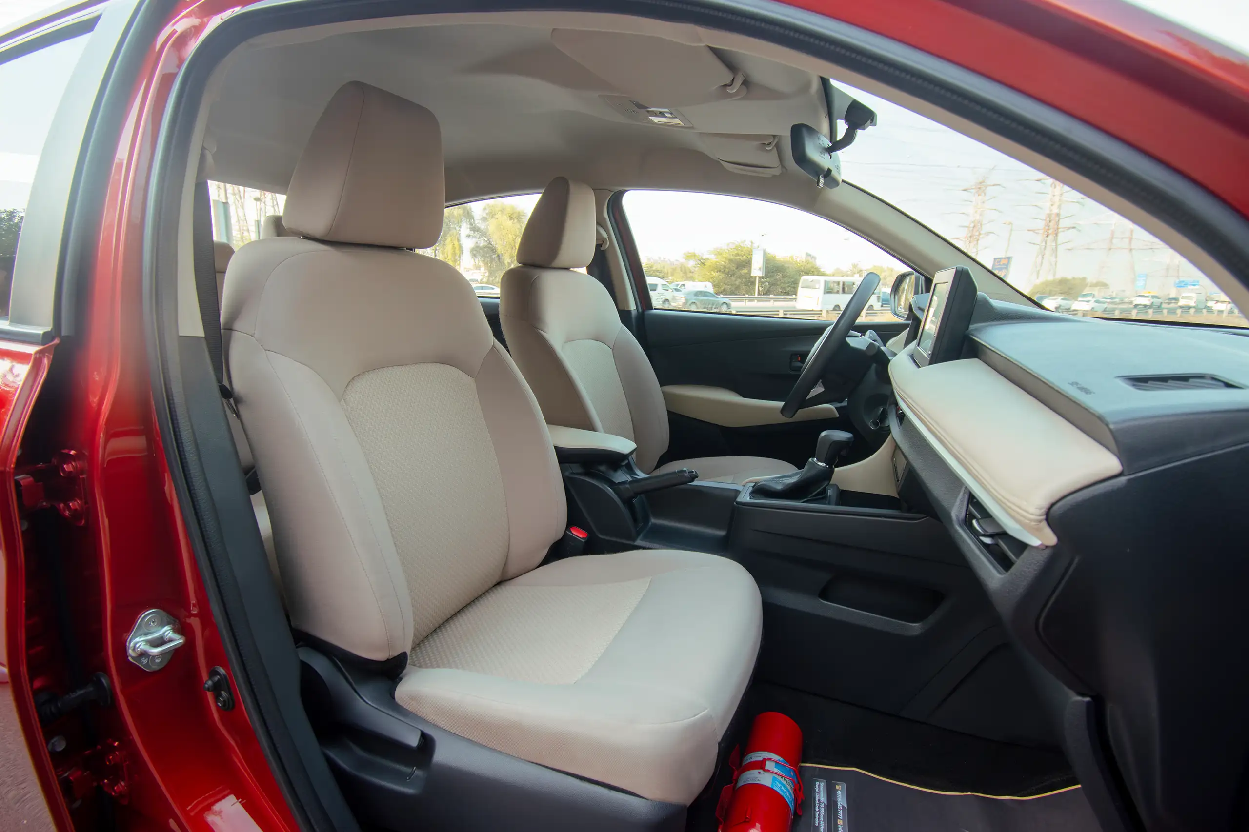 Used 2023 Toyota Yaris E Red – Front Passenger Side Cabin View at First Choice Cars Sharjah