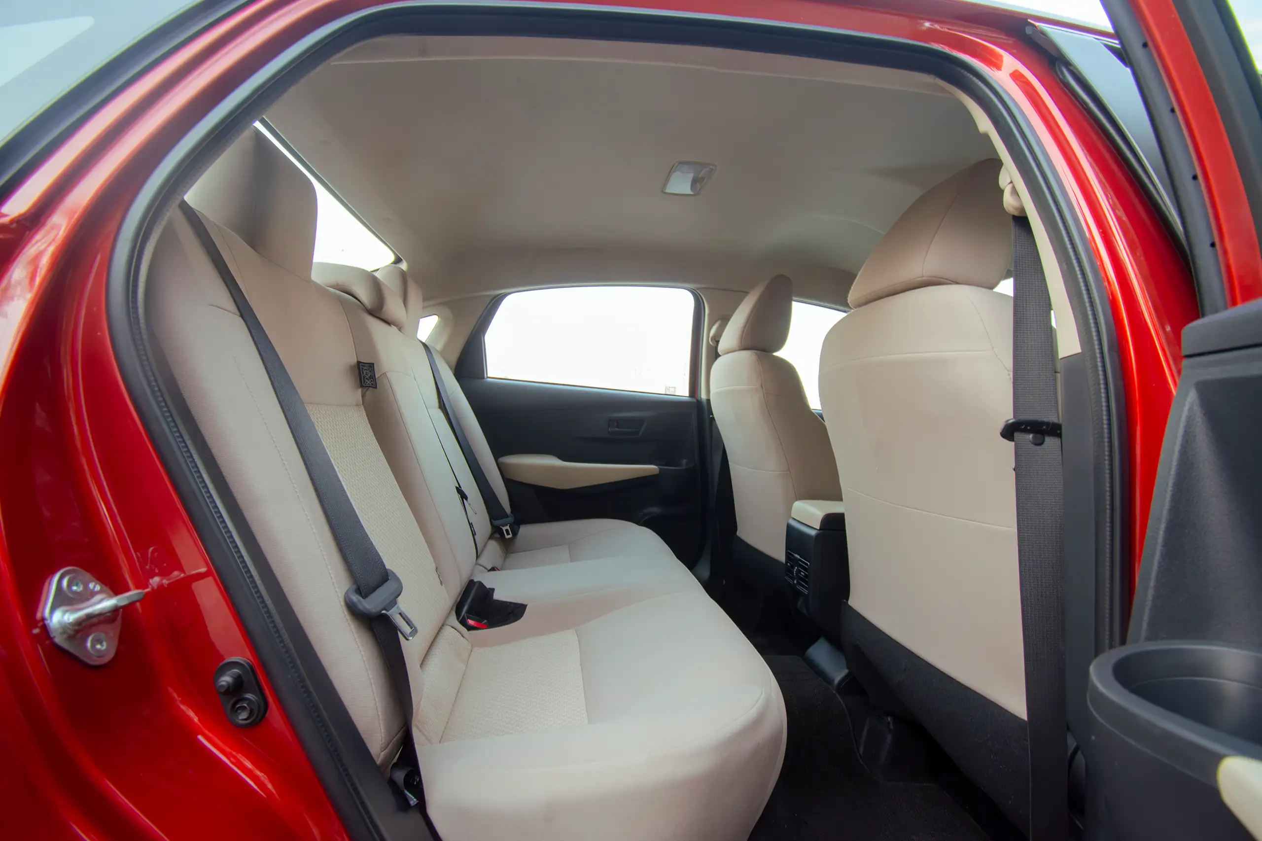 Used 2023 Toyota Yaris E Red – Rear Passenger Side Cabin View at First Choice Cars Sharjah