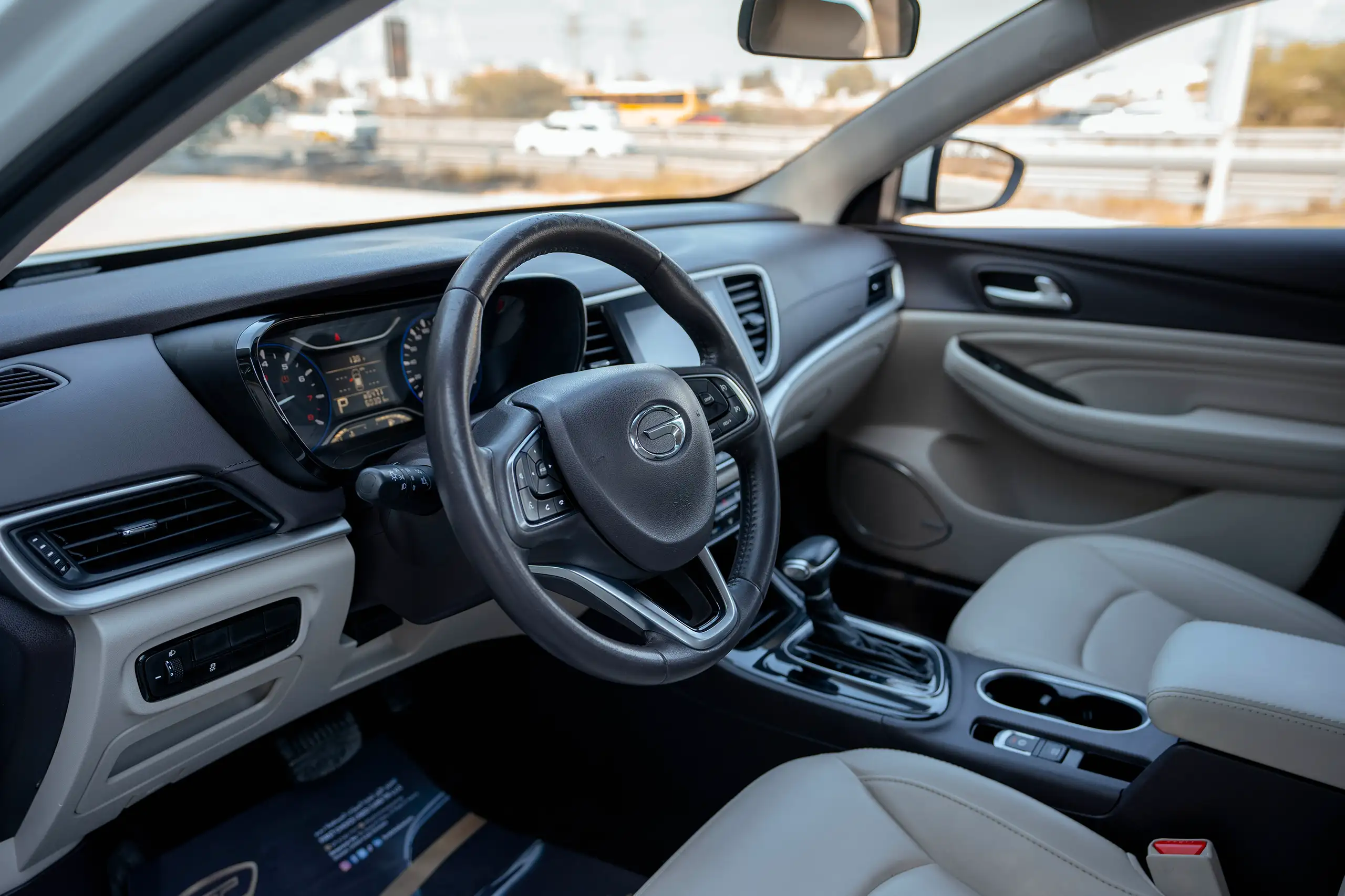 Used 2023 GAC GA4 GE White – Driver Side Dashboard & Steering View at First Choice Cars Sharjah