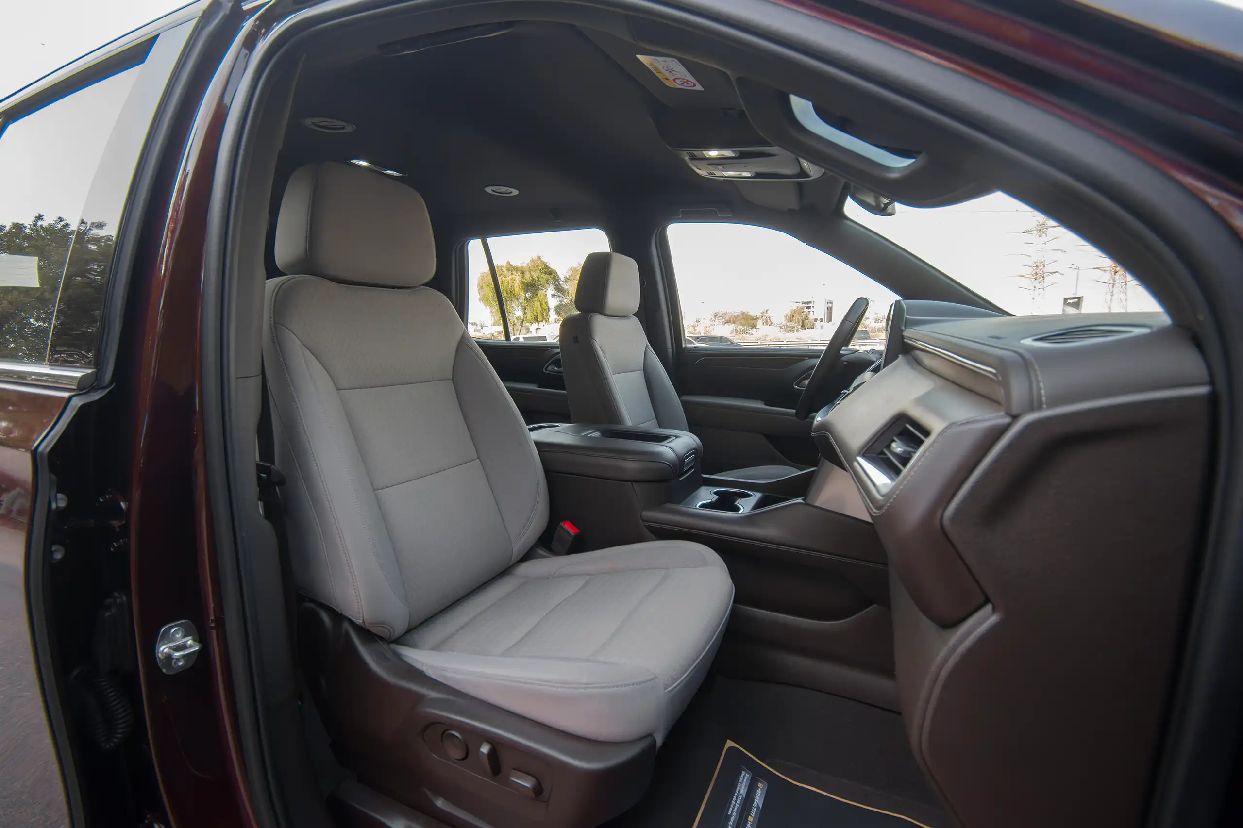 Used 2023 Chevrolet Tahoe LS Maroon – Front Passenger Side Cabin View at First Choice Cars Sharjah