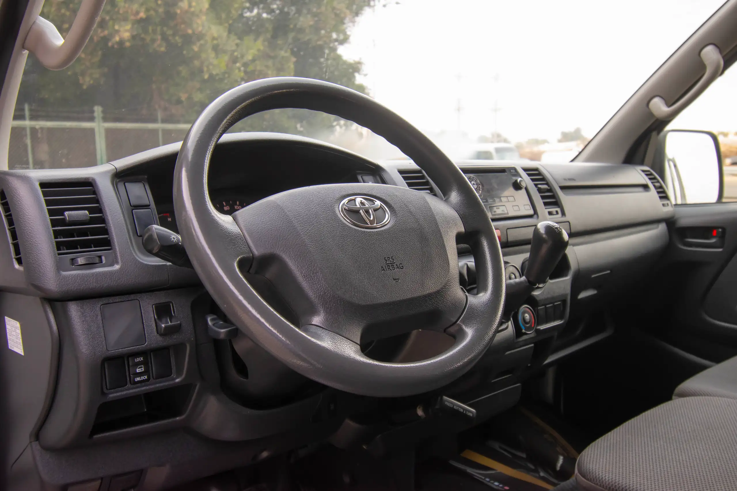 Used 2022 Toyota Hiace GL Std Roof 3 STR Panel Van White – Driver Side Dashboard & Steering View at First Choice Cars Sharjah