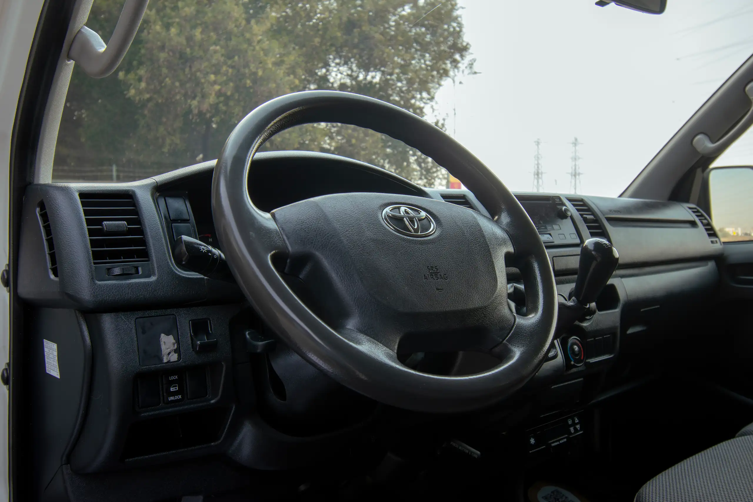 Used 2022 Toyota Hiace Std Roof - Chiller White – Driver Side Dashboard & Steering View at First Choice Cars Sharjah