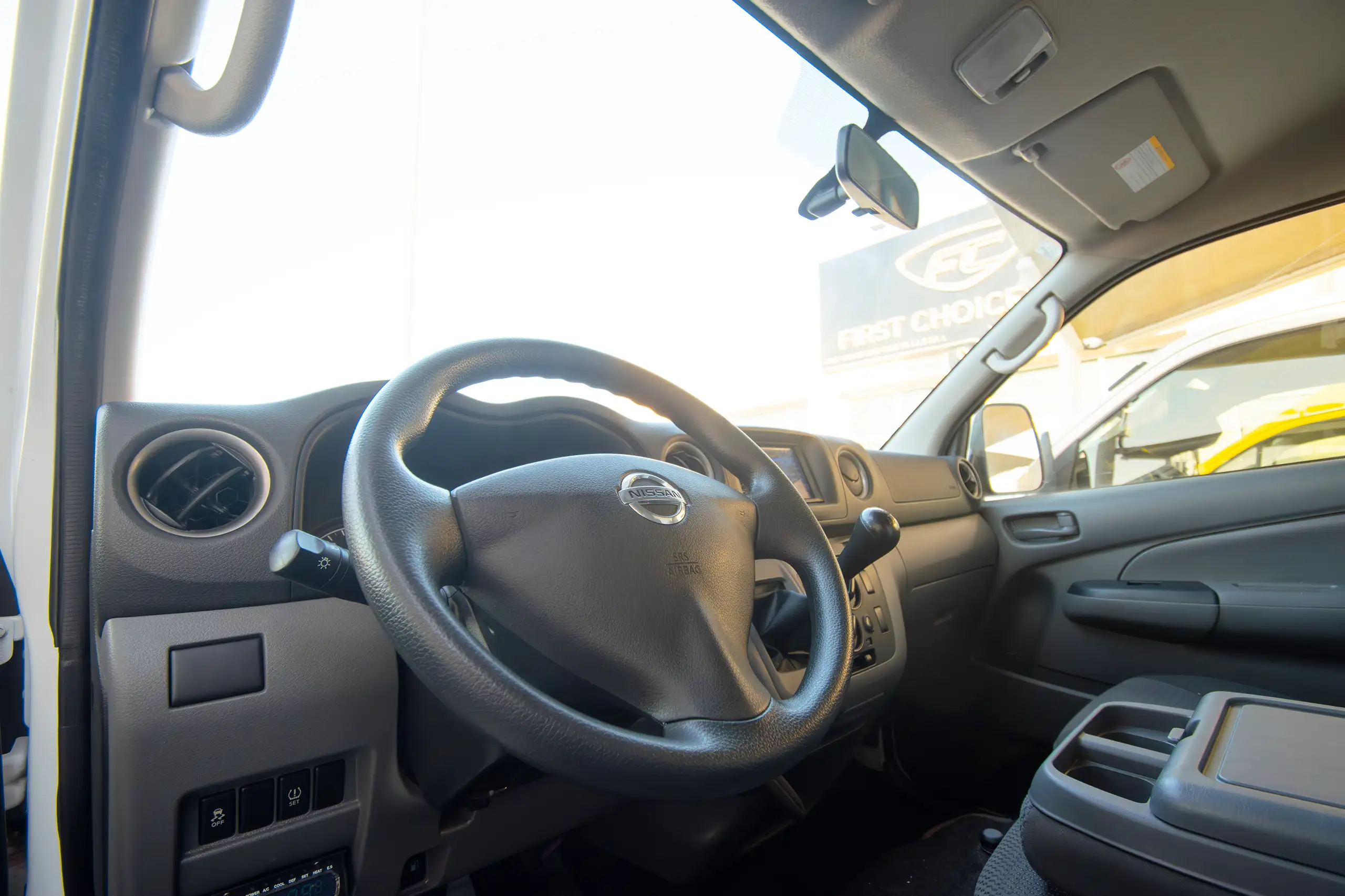 Used 2022 Nissan Urvan Standard Roof Chiller White – Driver Side Dashboard & Steering View at First Choice Cars Sharjah