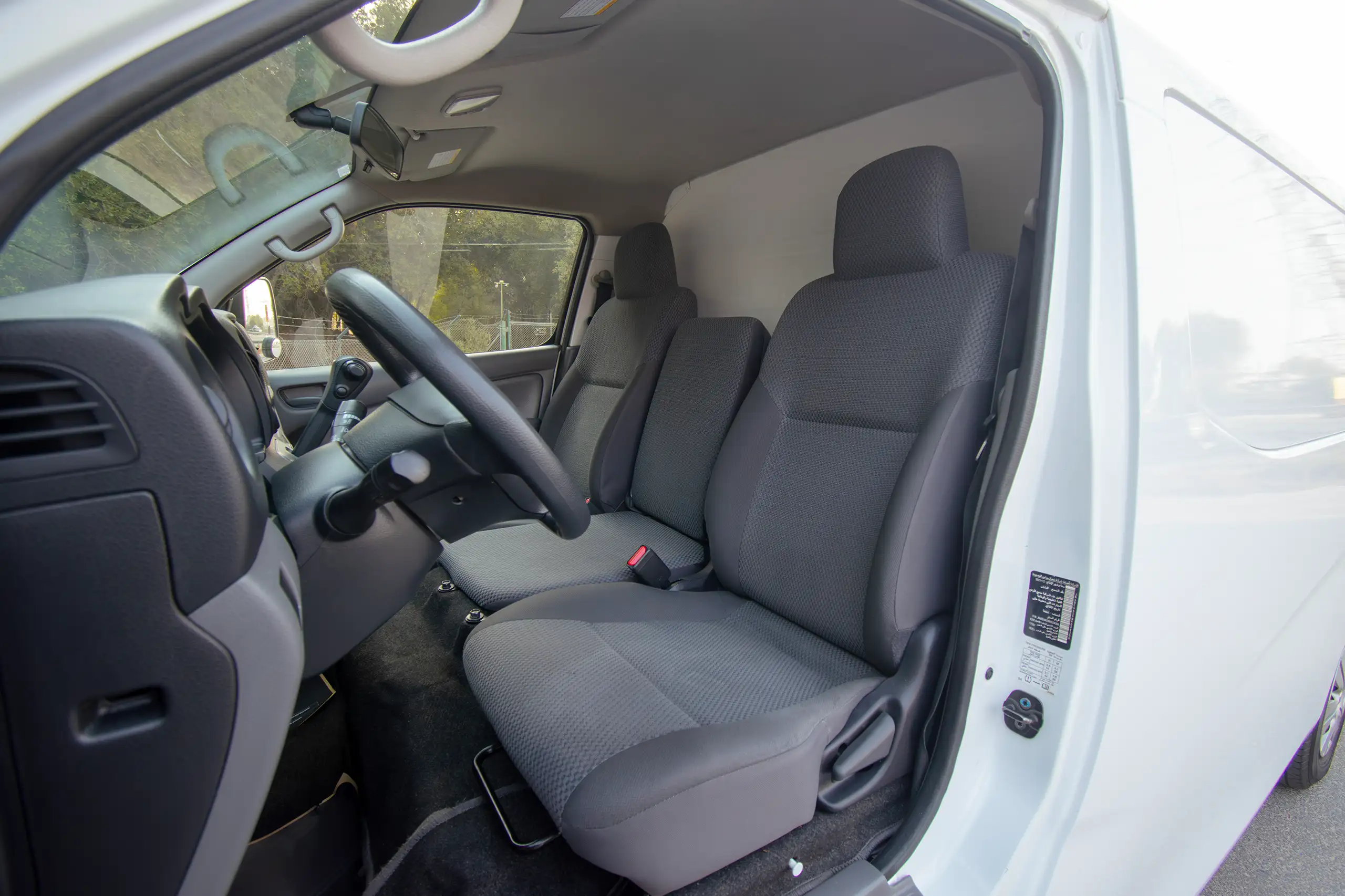 Used 2022 Nissan Urvan Panel Van S/R White – Front Driver Side Cabin View at First Choice Cars Sharjah