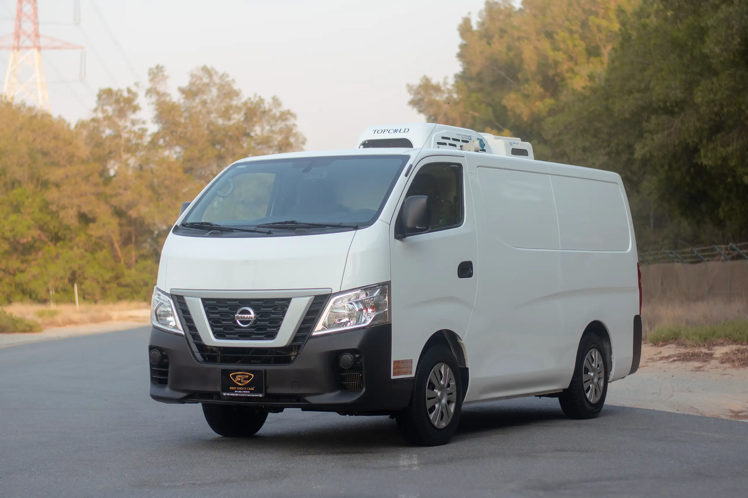 Used 2022 Nissan Urvan Standard Roof Chiller White – Left Front Diagonal (45°) View at First Choice Cars Sharjah