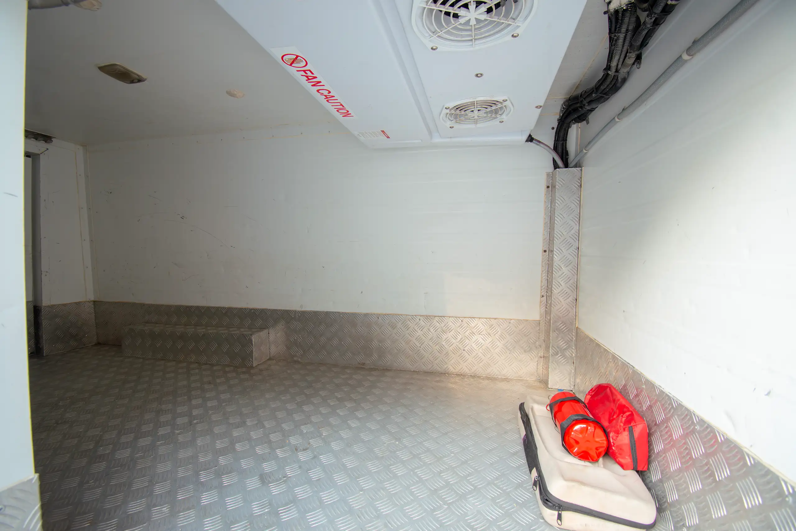 Used 2022 Nissan Urvan Standard Roof Chiller White – Freezer Box Right Side Interior View at First Choice Cars Sharjah