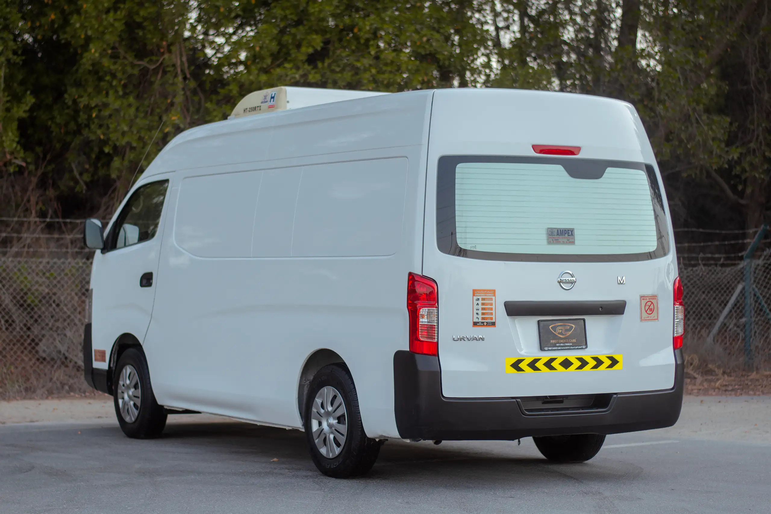 Used 2022 Nissan Urvan High Roof Chiller White – Left Back Diagonal (45°) View at First Choice Cars Sharjah