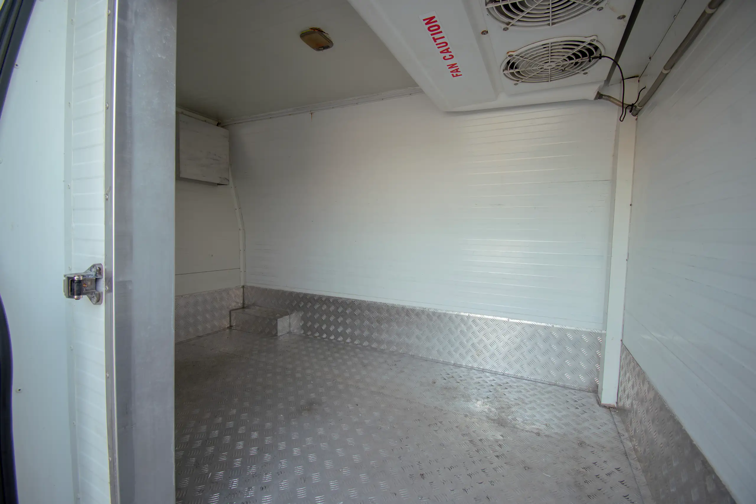 Used 2022 Nissan Urvan High Roof Chiller White – Freezer Box Right Side Interior View at First Choice Cars Sharjah