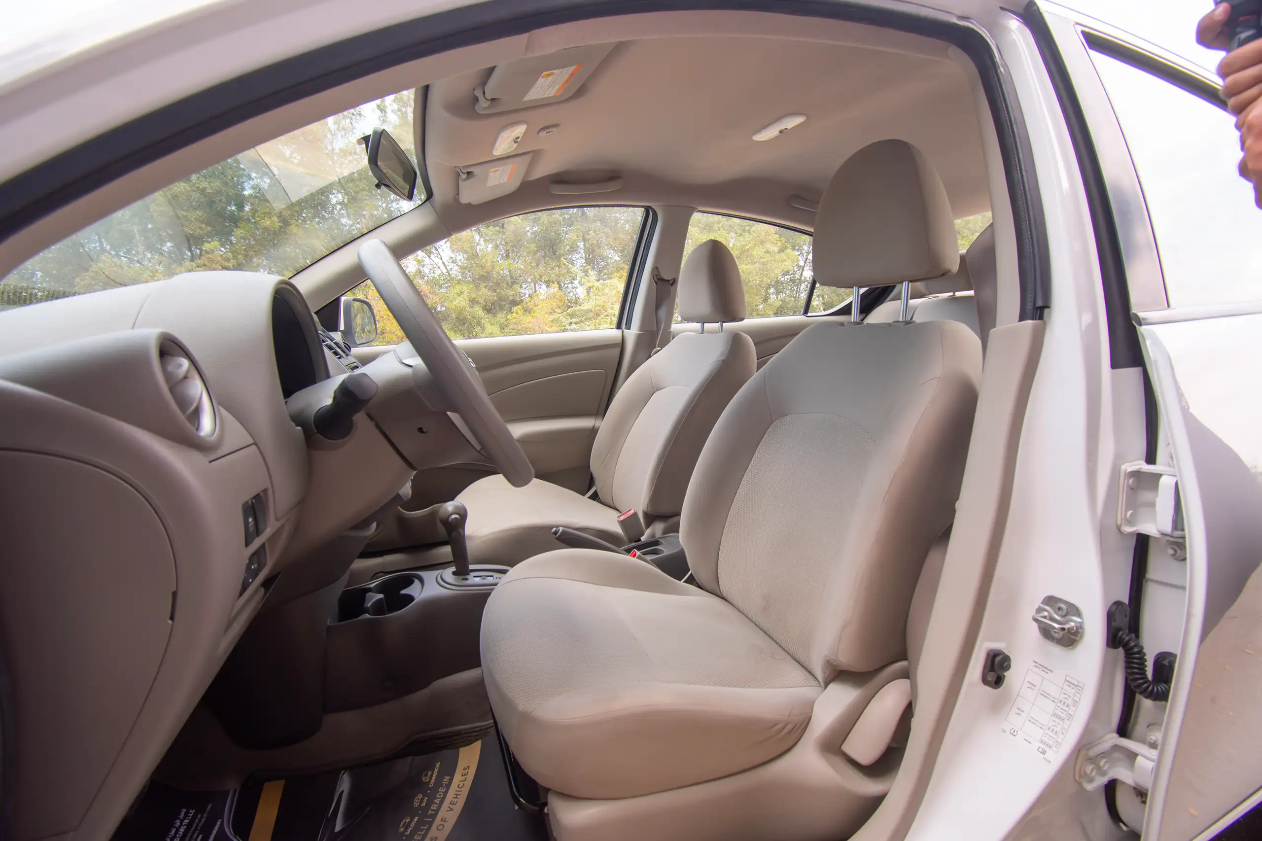 Used 2022 Nissan Sunny SV White – Front Driver Side Cabin View at First Choice Cars Sharjah