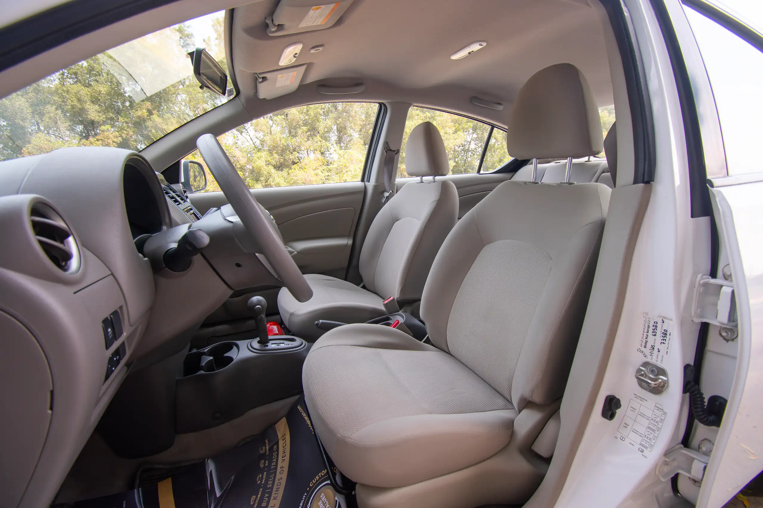 Used 2022 Nissan Sunny SV White – Front Driver Side Cabin View at First Choice Cars Sharjah