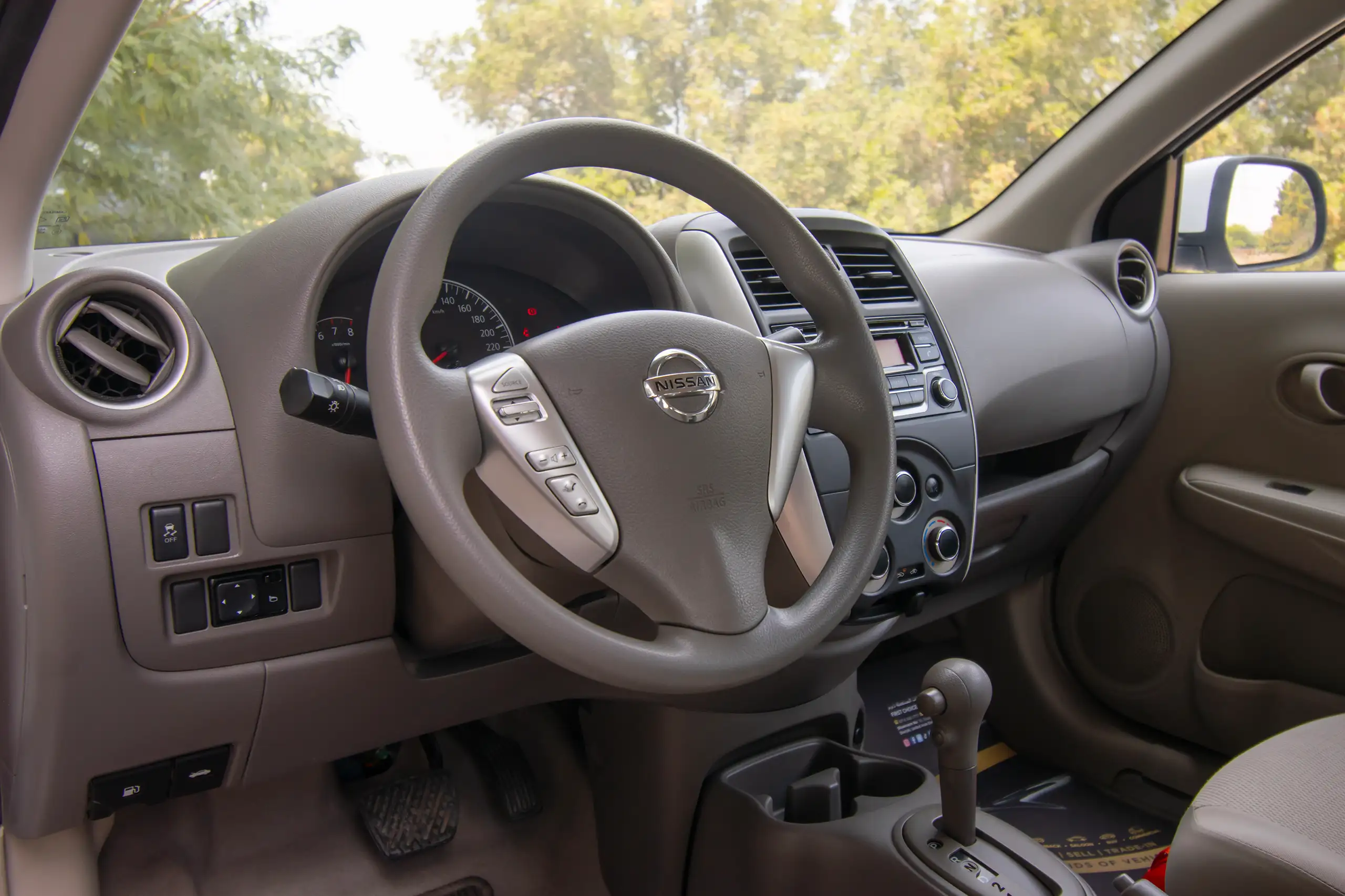 Used 2022 Nissan Sunny SV White – Driver Side Dashboard & Steering View at First Choice Cars Sharjah