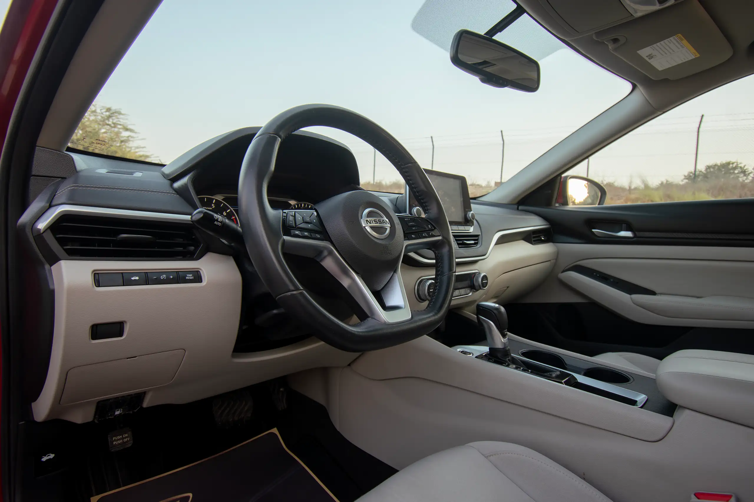 Used 2022 Nissan Altima SV Red – Driver Side Dashboard & Steering View at First Choice Cars Sharjah