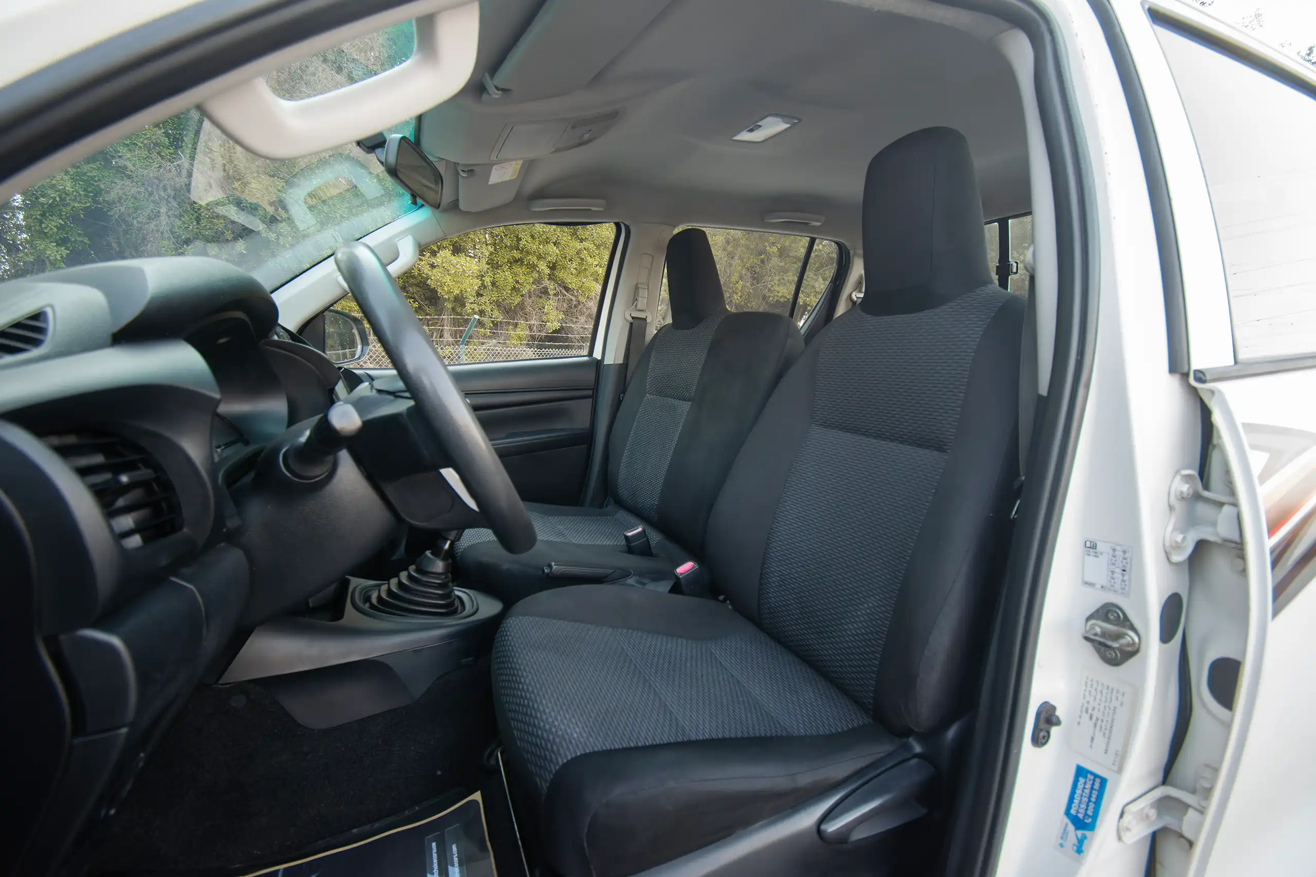 Used 2021 Toyota Hilux GLX Double Cabin 2.7L 4x4 (petrol) White – Front Driver Side Cabin View at First Choice Cars Sharjah