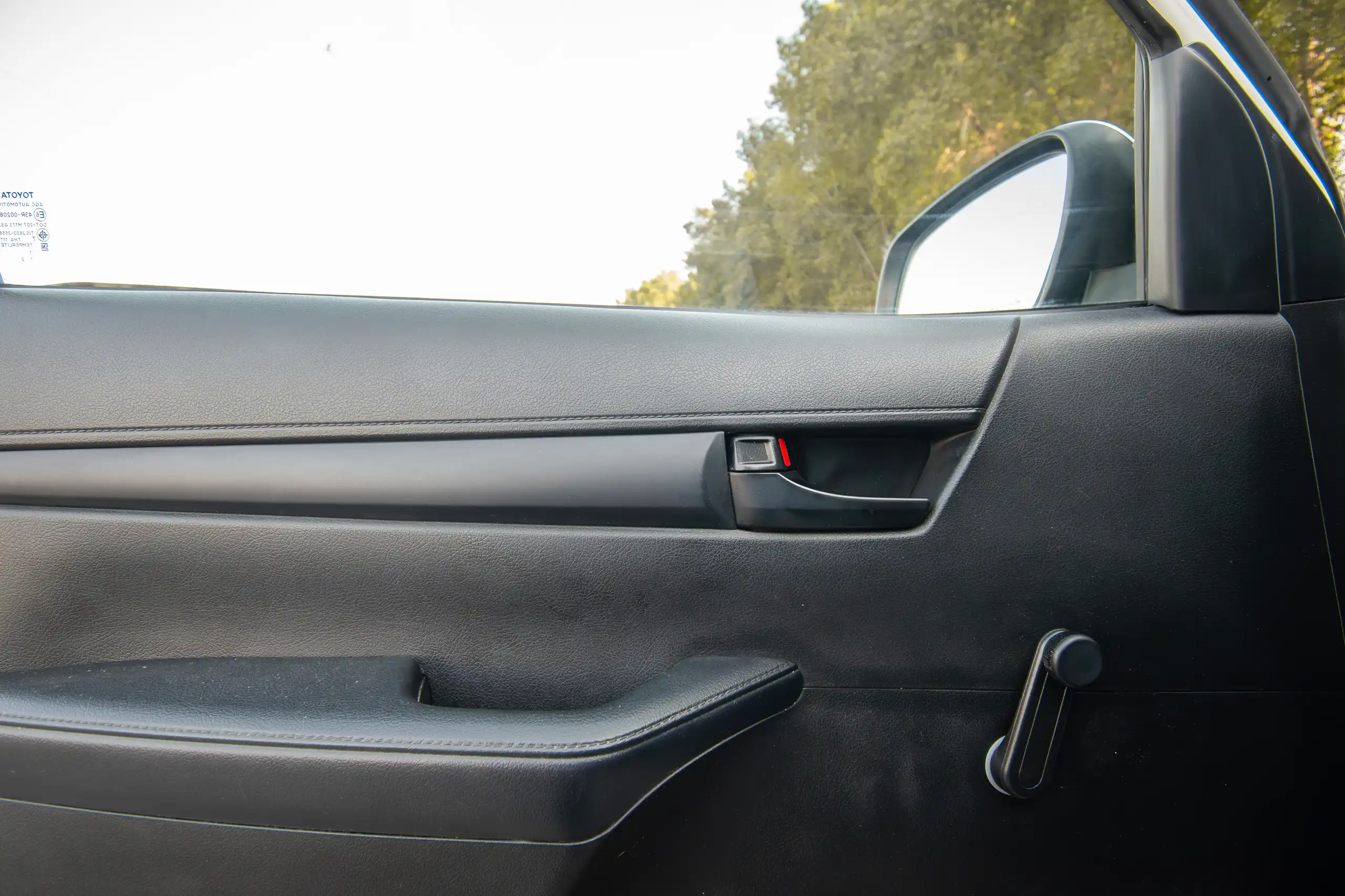 Used 2021 Toyota Hilux GLX Double Cabin 2.7L 4x4 (petrol) White – Driver Door Panel Full View at First Choice Cars Sharjah