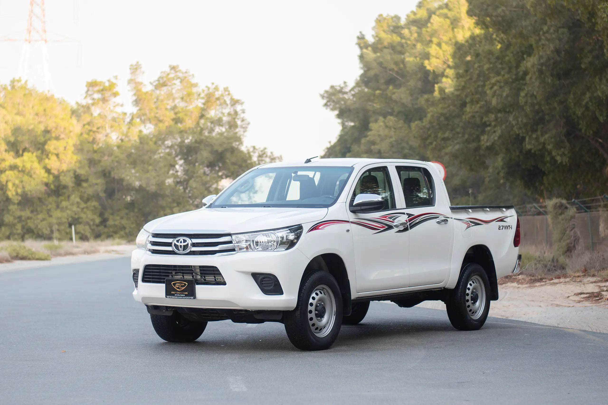 Used 2021 Toyota Hilux GLX Double Cabin White – Left Front Diagonal (45°) View at First Choice Cars Sharjah