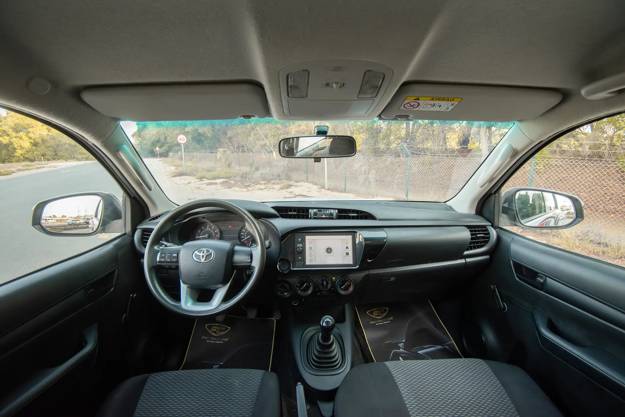 Used 2021 Toyota Hilux GLX Double Cabin White – Front Cabin / Dashboard Full View at First Choice Cars Sharjah