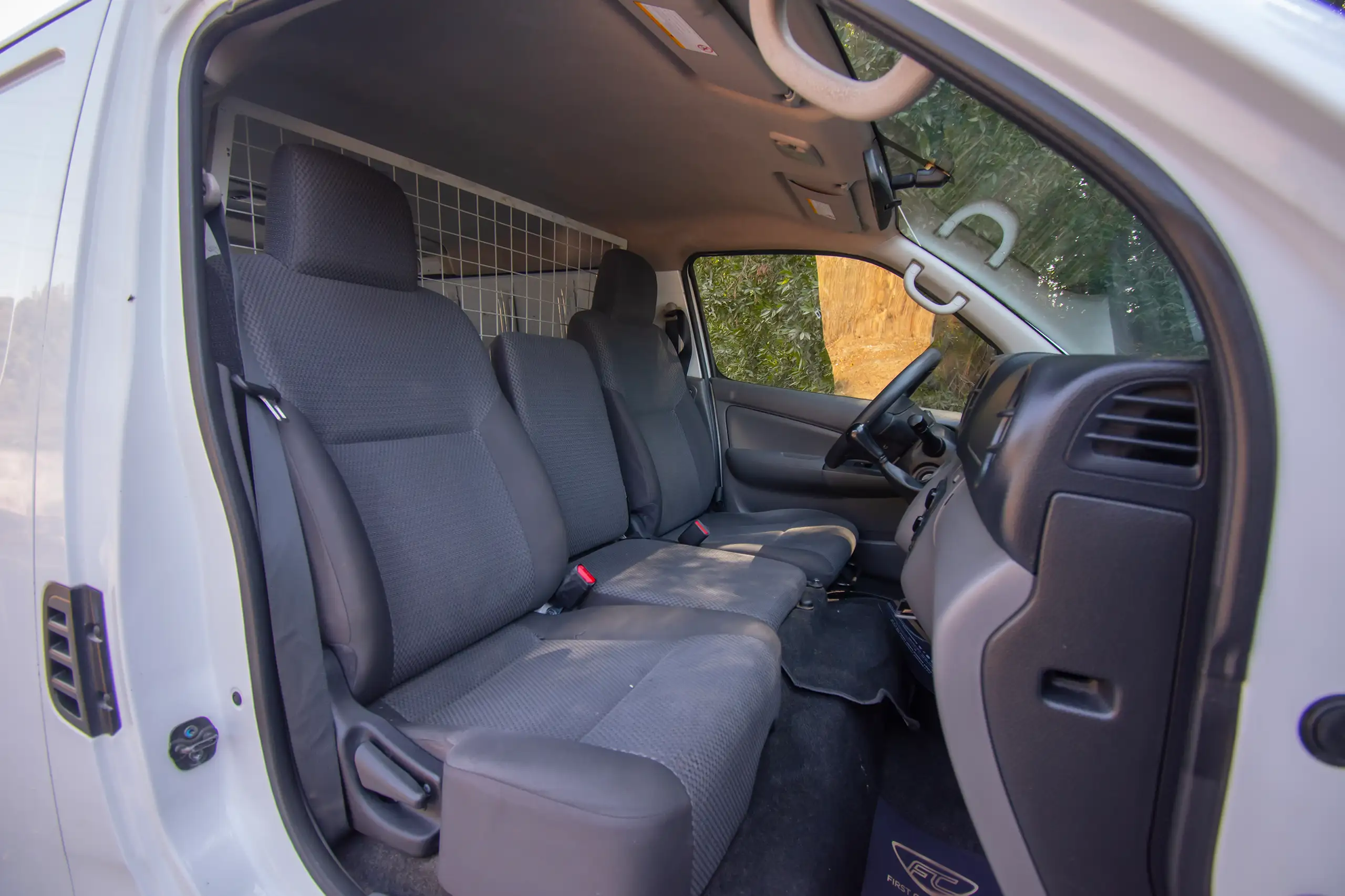 Used 2021 Nissan Urvan Panel Van S/R White – Front Passenger Side Cabin View at First Choice Cars Sharjah