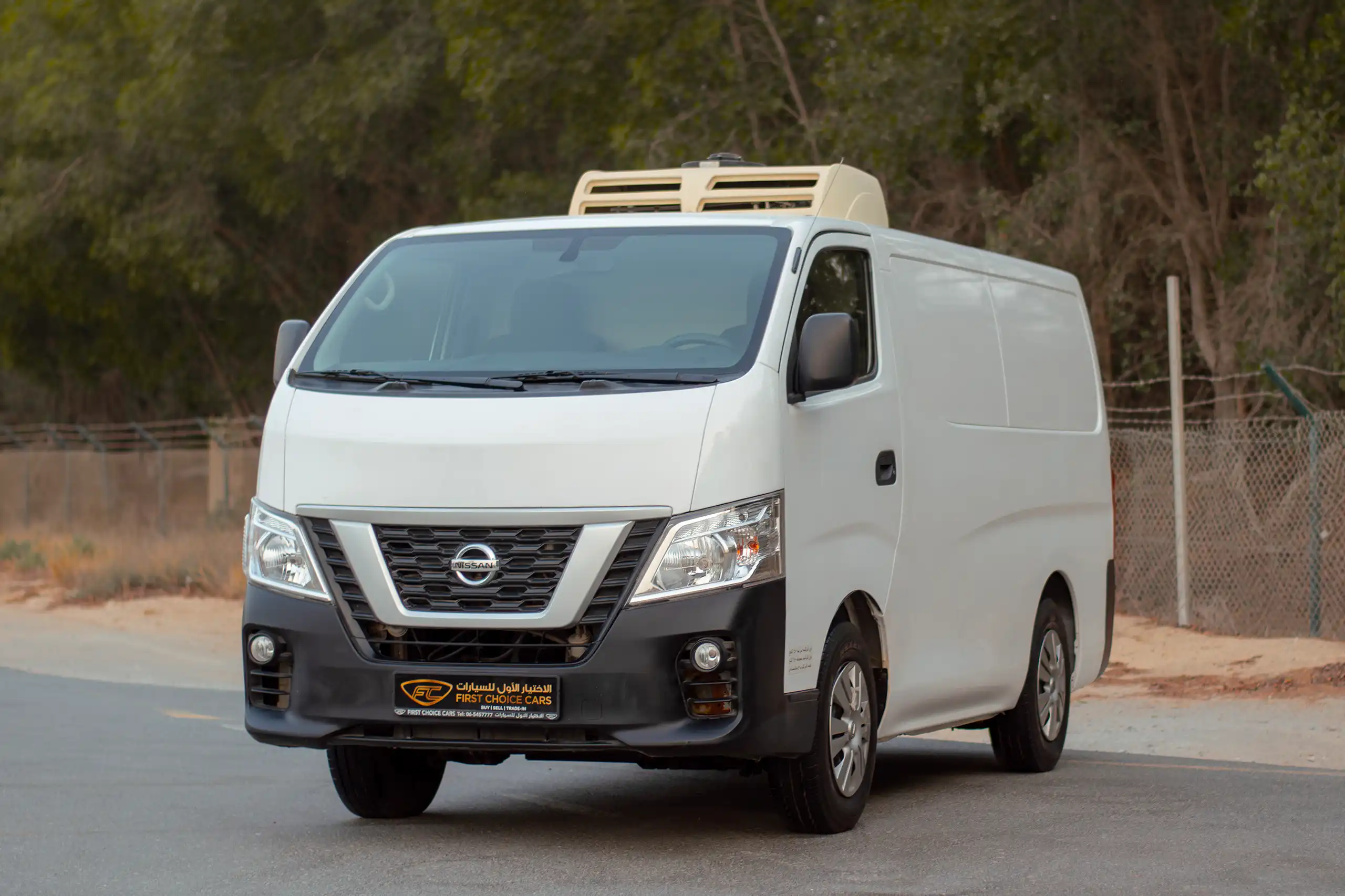 Used 2021 Nissan Urvan Standard Roof Chiller White – Left Front Diagonal (45°) View at First Choice Cars Sharjah