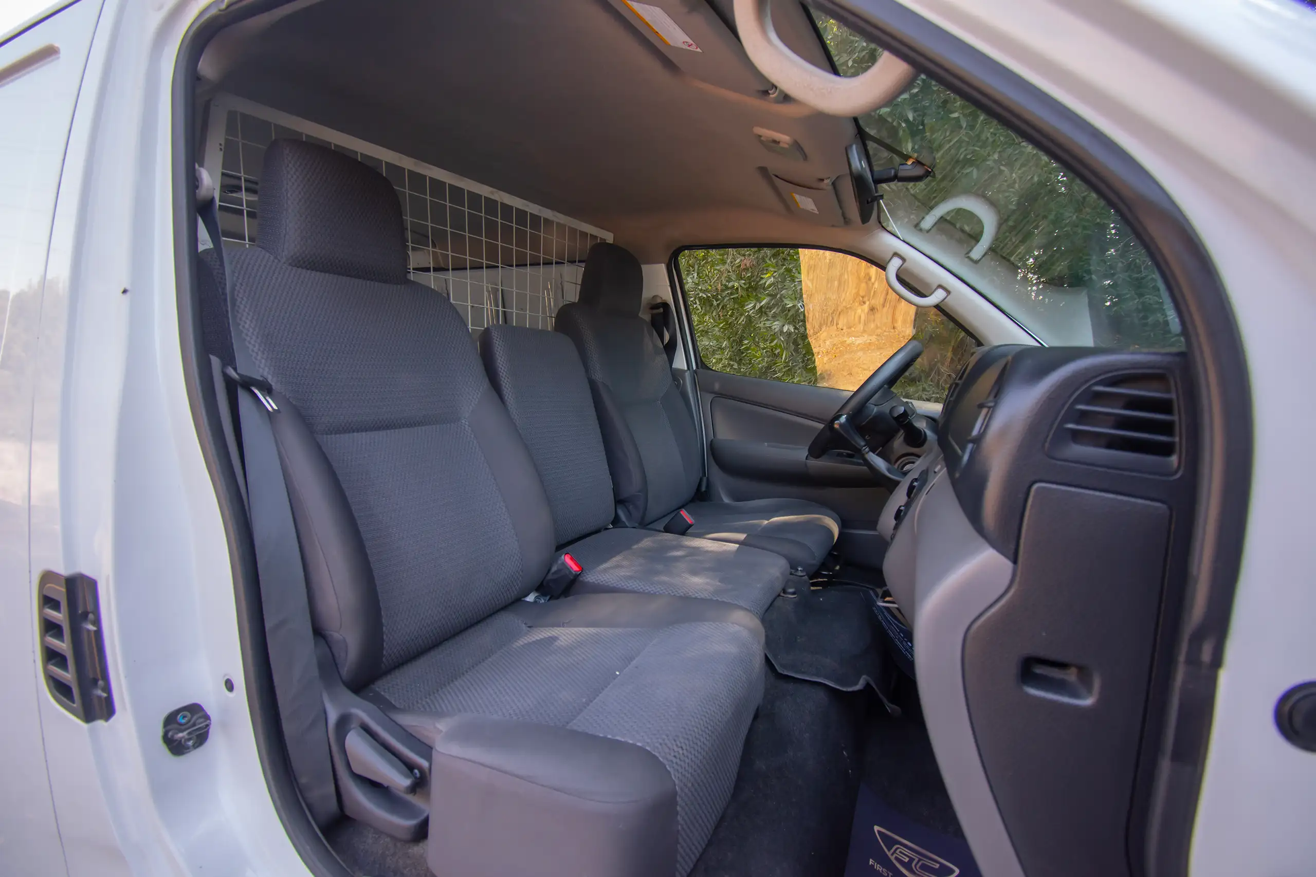 Used 2021 Nissan Urvan Panel Van S/R White – Front Passenger Side Cabin View at First Choice Cars Sharjah