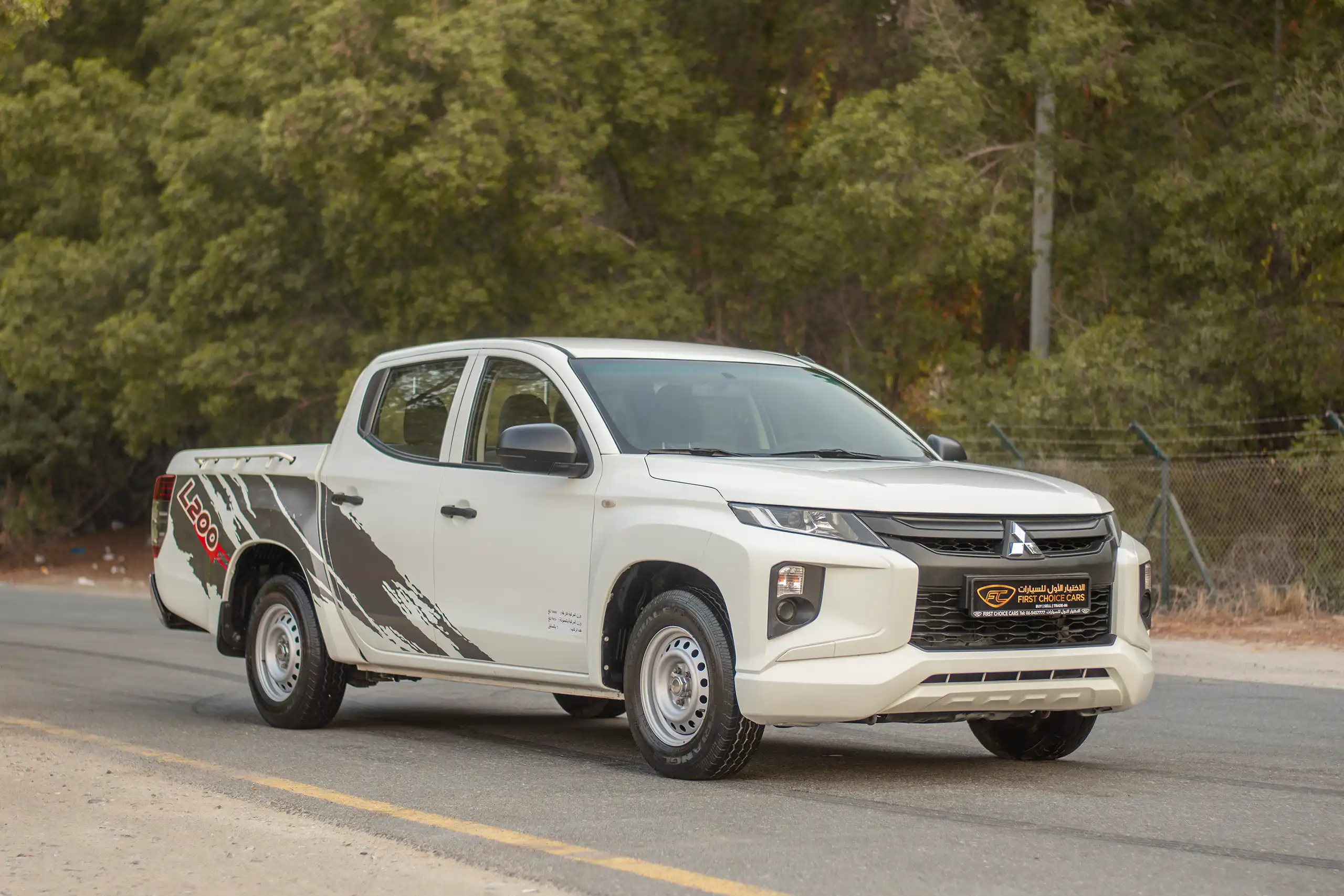 Used 2021 Mitsubishi L200 Double Cab GLX White – Right Front Diagonal (45°) View at First Choice Cars Sharjah