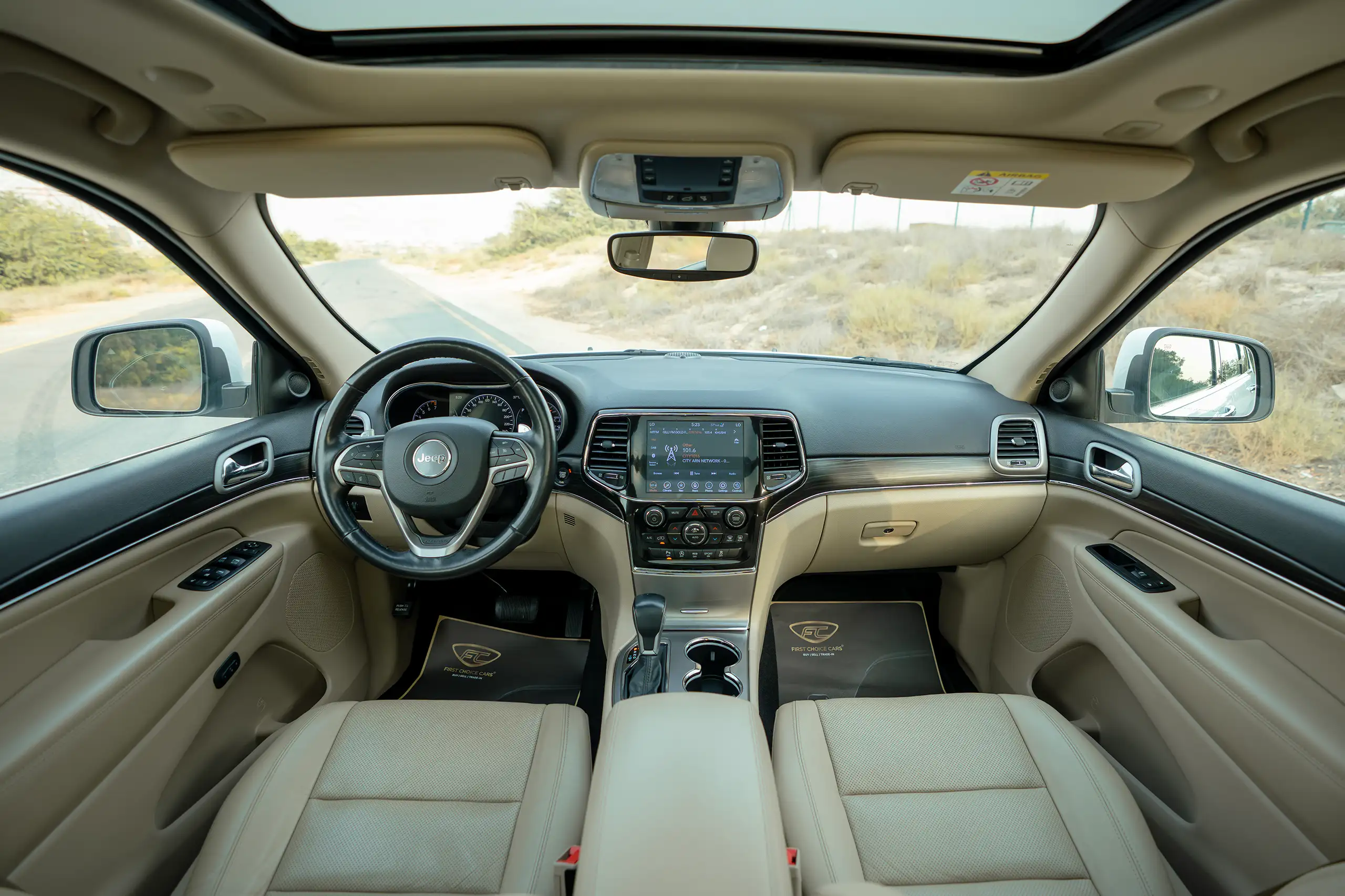 Used 2021 Jeep Grand Cherokee Limited White – Front Cabin / Dashboard Full View at First Choice Cars Sharjah