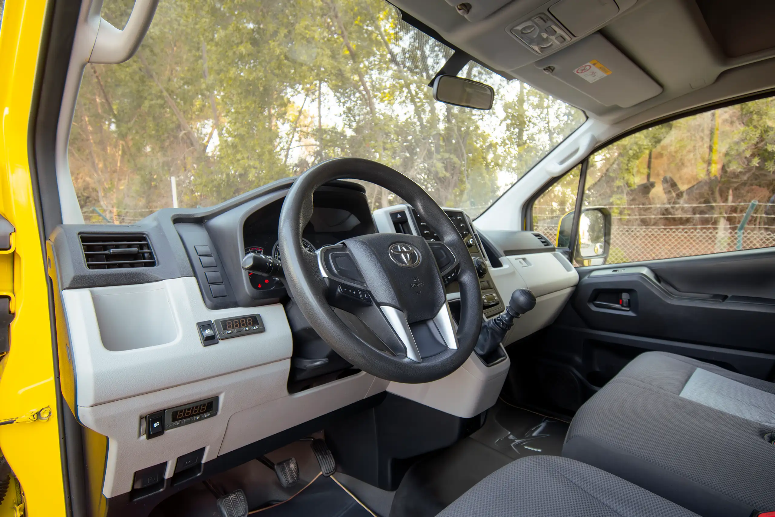 Used 2020 Toyota Hiace GL- High Roof Freezer Van Yellow – Driver Side Dashboard & Steering View at First Choice Cars Sharjah
