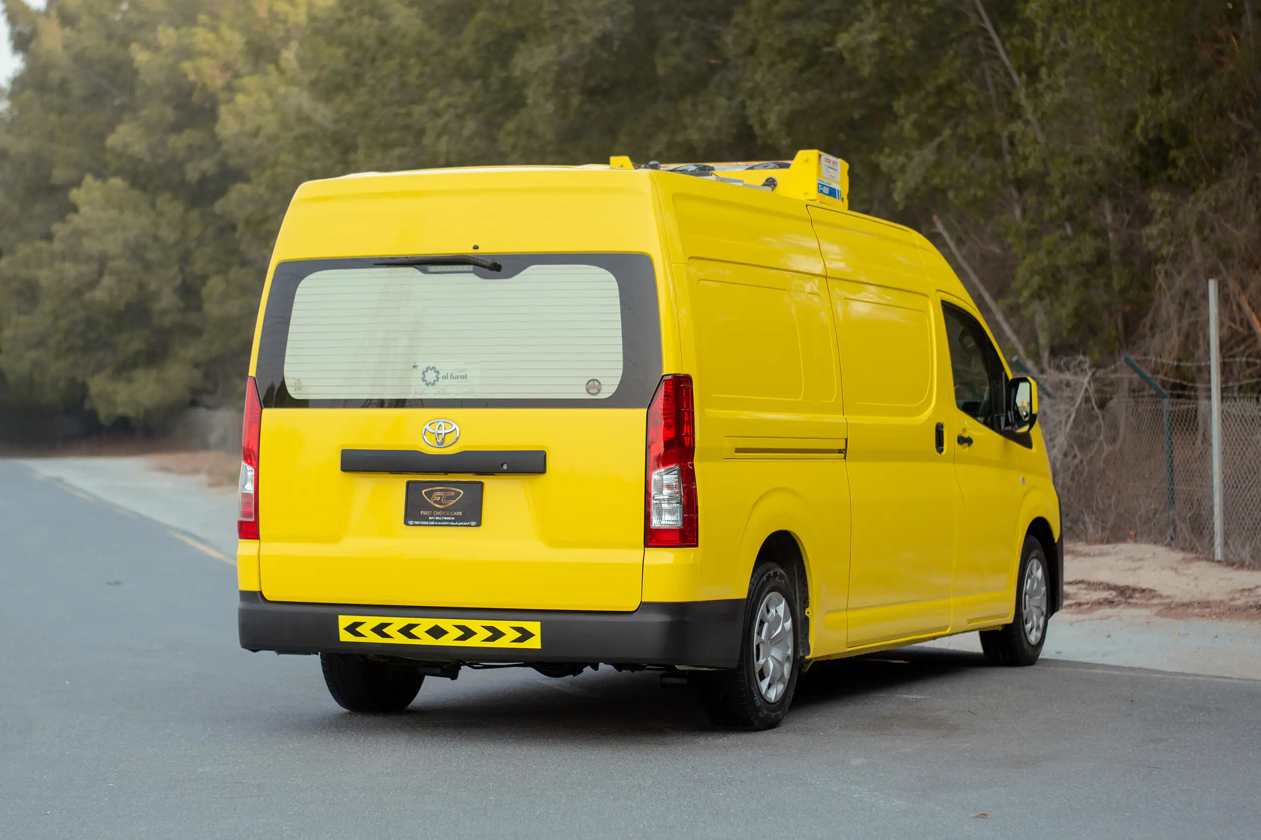 Used 2020 Toyota Hiace GL- High Roof Yellow – Right Back Diagonal (45°) View at First Choice Cars Sharjah