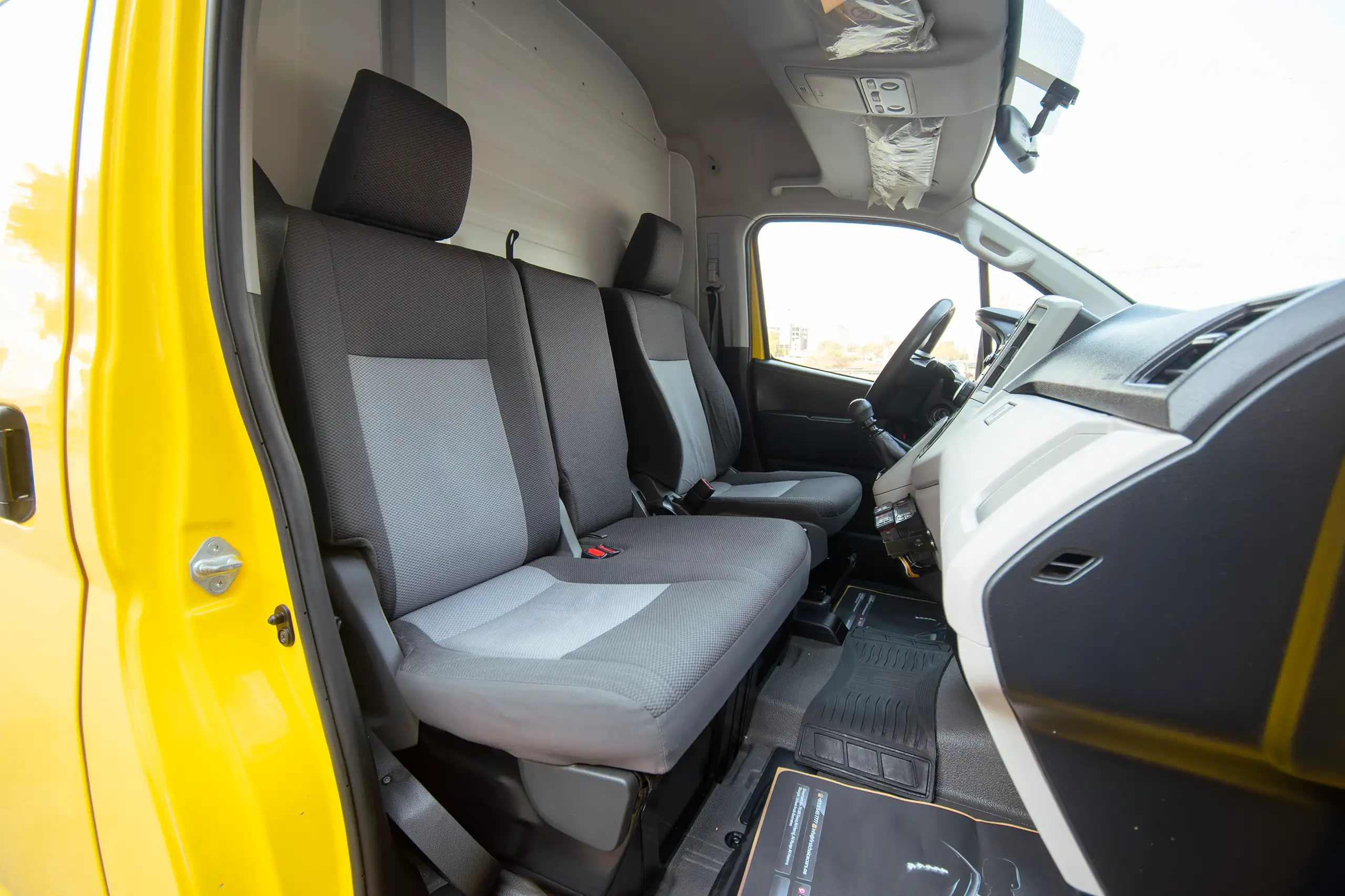 Used 2020 Toyota Hiace GL- High Roof Yellow – Front Passenger Side Cabin View at First Choice Cars Sharjah