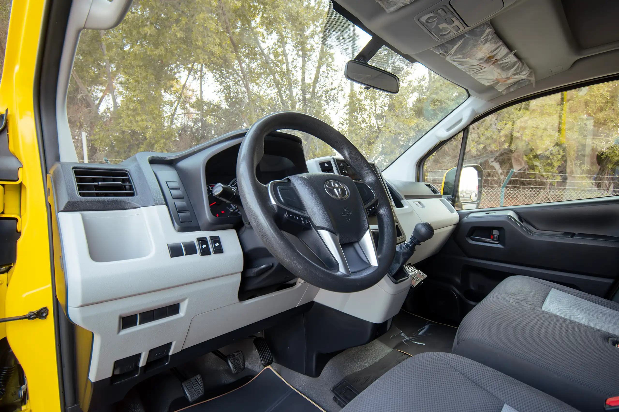 Used 2020 Toyota Hiace GL- High Roof Yellow – Driver Side Dashboard & Steering View at First Choice Cars Sharjah