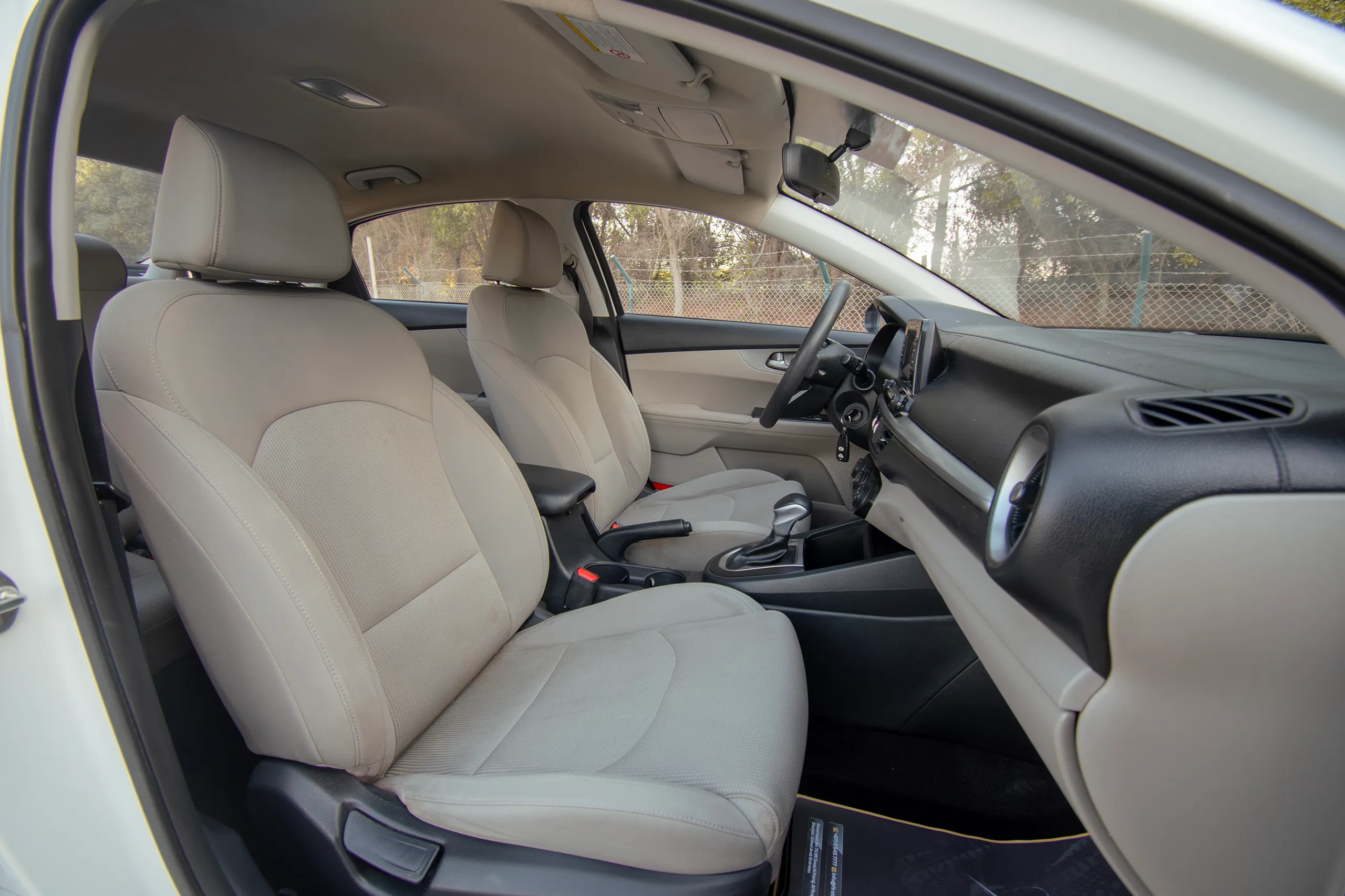 Used 2020 KIA Cerato Lx White – Front Passenger Side Cabin View at First Choice Cars Sharjah