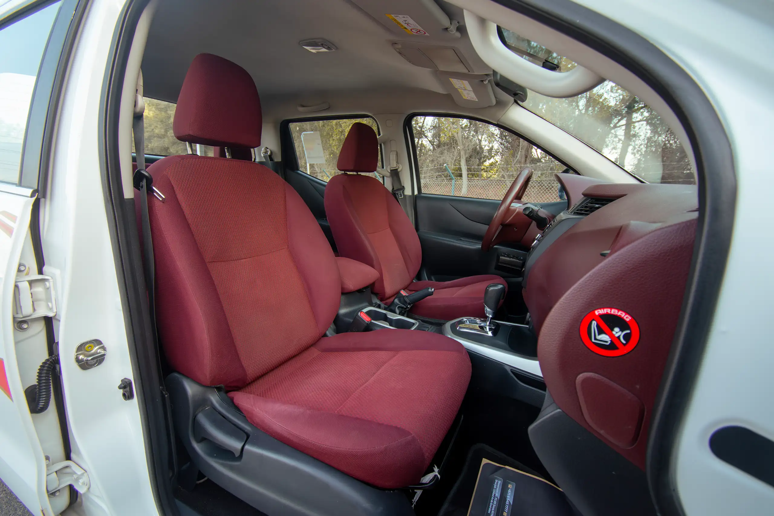 Used 2019 Nissan Navara SE 4x4 White – Front Passenger Side Cabin View at First Choice Cars Sharjah