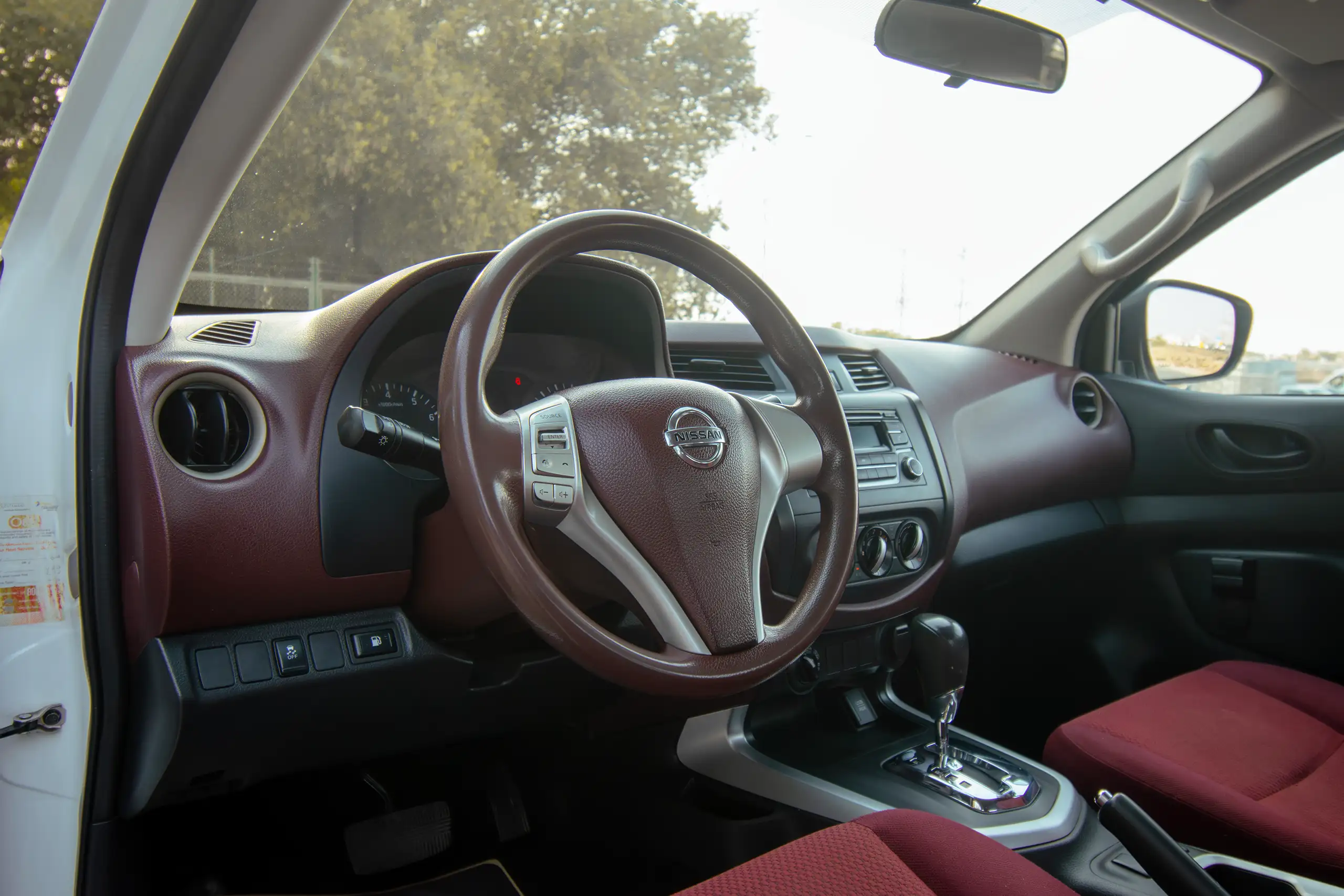 Used 2019 Nissan Navara SE 4x4 White – Driver Side Dashboard & Steering View at First Choice Cars Sharjah